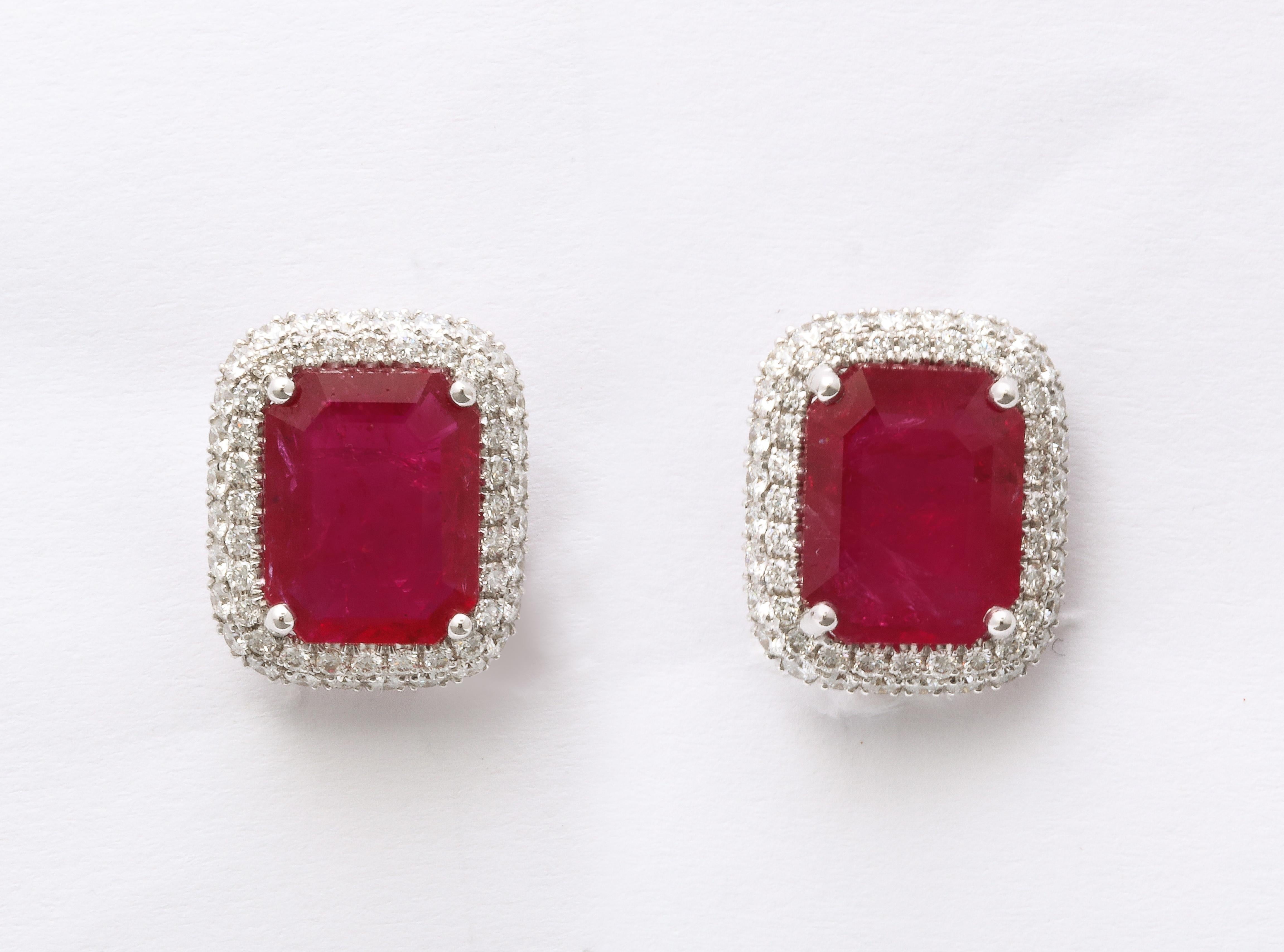 
7.20 carats of certified Intense Red emerald cut Ruby. 

1.34 carats of white round brilliant cut diamonds. 

Just over half an inch long 

Certified by Christian Dunaigre of Switzerland 

A matching pair of rubies in this shape are a rare