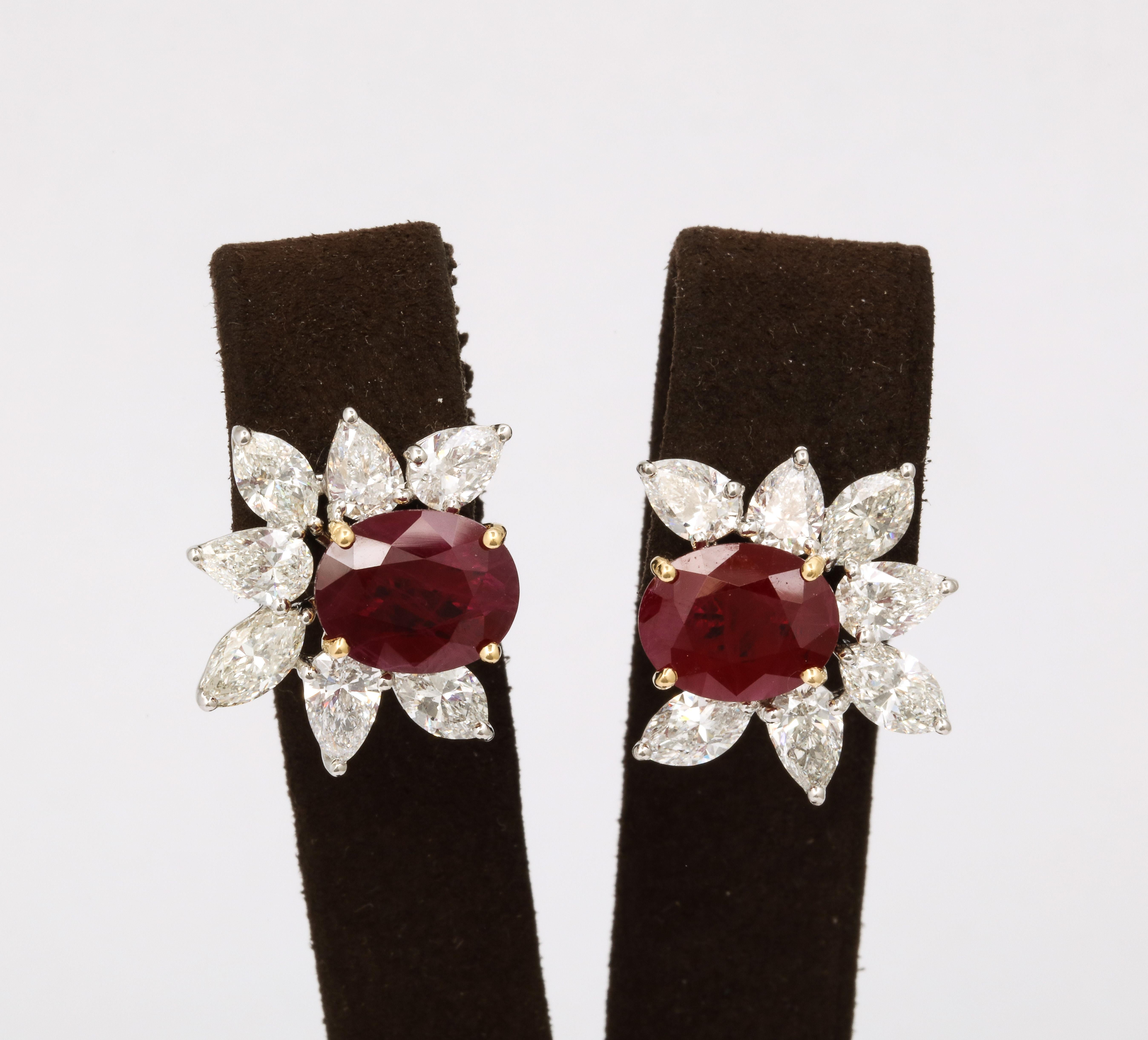 
A stunning pair of rare Burma Ruby earrings. 

9.45 carats of Certified INTENSE RED Oval Burma Ruby. 

7.72 carats of white pear and marquise shaped diamonds. 

Set in platinum and 18k yellow gold. 

Certified by Christian Dunaigre of Switzerland.