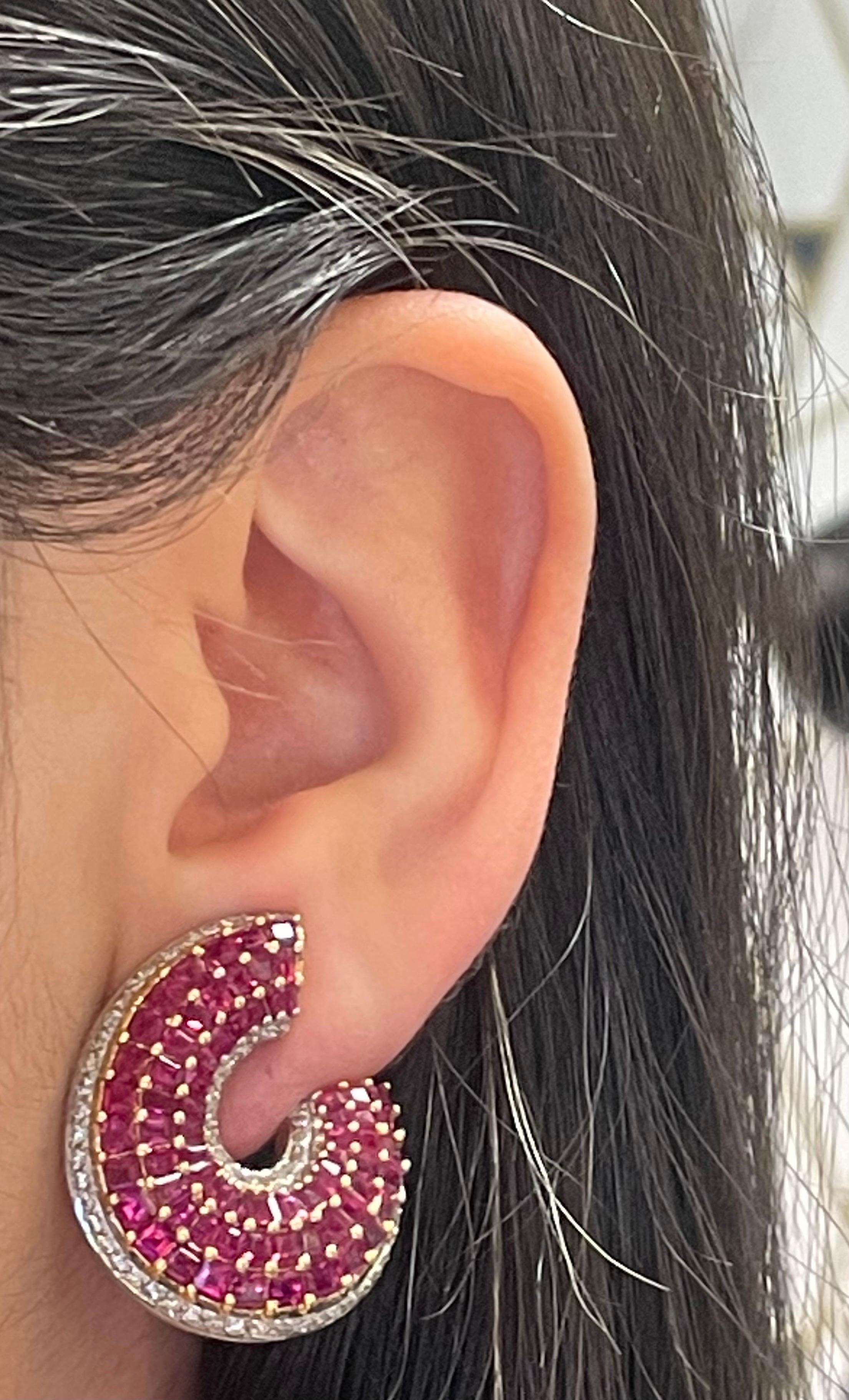 Circular Ruby Earrings 

Yellow gold and white gold circular earrings with 144 rubies and 112 brilliant round diamonds. 

Approximate combined ruby weight: 12.80 carats
Approximate combined diamond weight: 1.55 carats 
Approximately measures 1