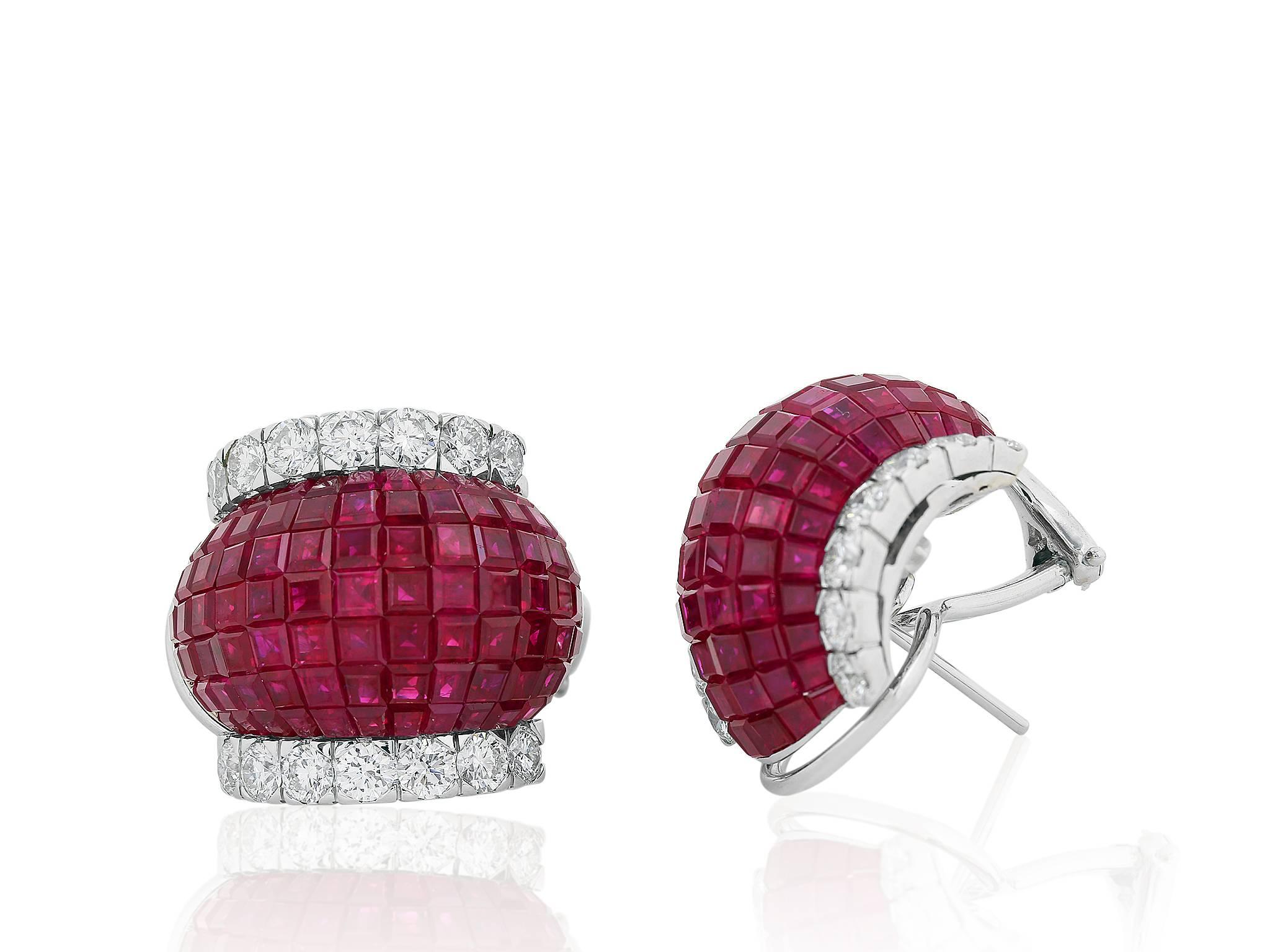 18 karat white gold clip earrings consisting of 182 invisible set princess cut rubies having a total weight 16.59 carats set with 36 round brilliant cut diamonds having a total weight of 1.58 carats.