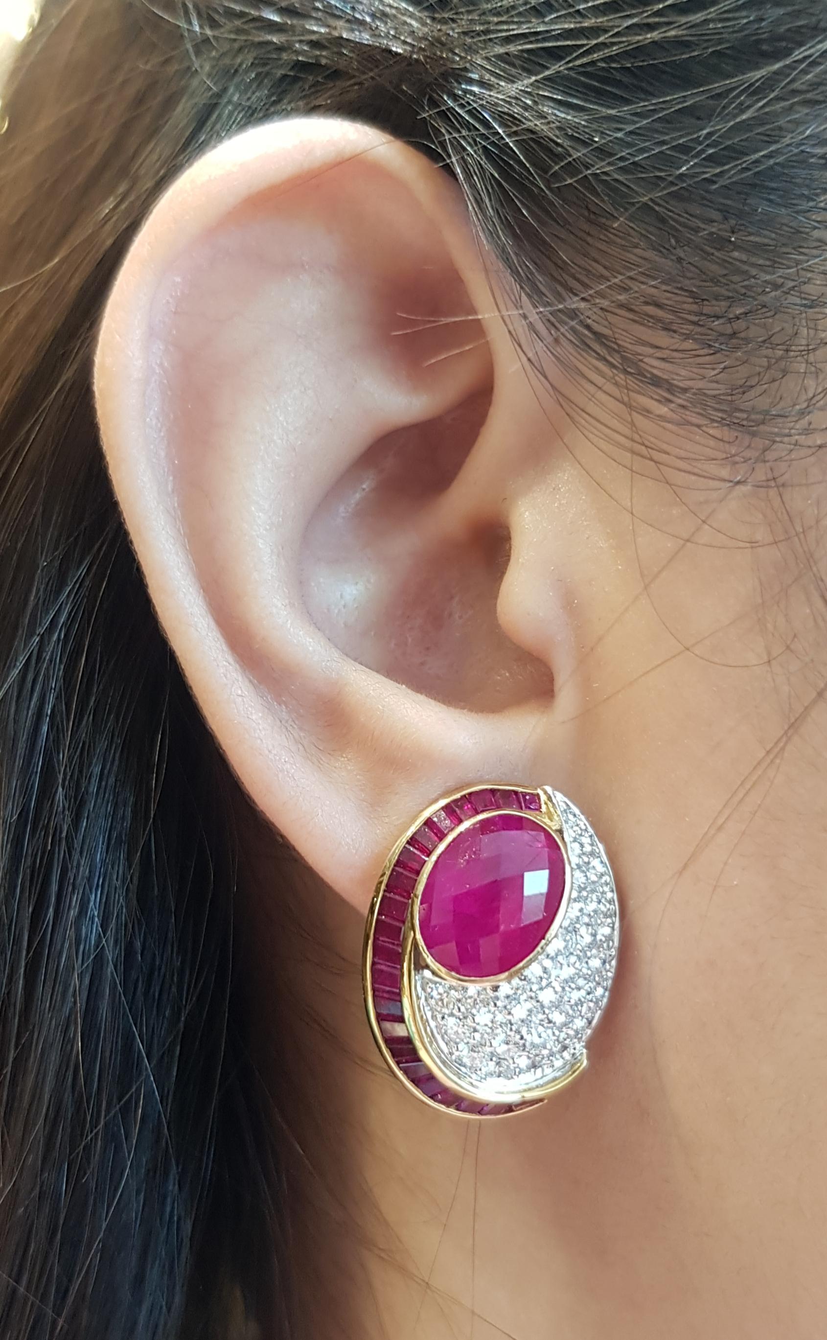 Ruby 5.94 carats (center) with Ruby 4.41 carats and Diamond 2.03 carats Earrings set in 18 Karat Gold Settings

Width:  2.0 cm 
Length: 2.5 cm
Total Weight: 17.41 grams

