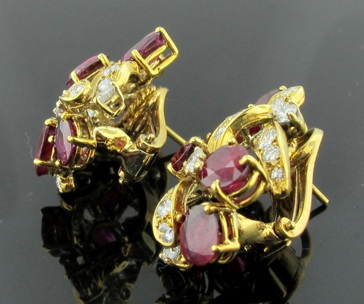 12 Oval Rubies, weighing 12 carats, with 42 round brilliant cut diamonds interwoven between the Rubies, with a total weight of 3.00 carats, set in 18 karat yellow gold.  
