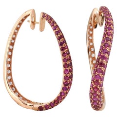 Used Ruby and Diamond Earrings set in 18K Rose Gold Settings 