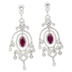 Boucles d'oreilles rubis et diamants montées sur or blanc 18K