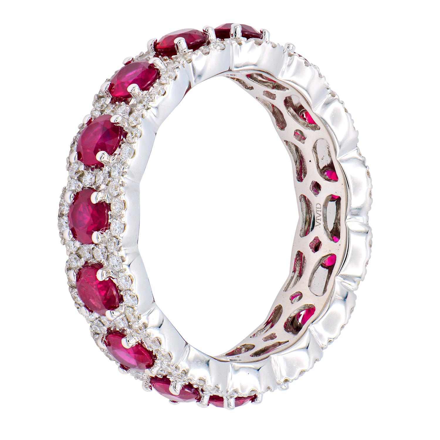 This Ruby and Diamond eternity band is a full circle of beauty and elegance. This band contains 15 deep red rubies totaling 2.57 carats surrounded by 150 round VS2, G color diamonds totaling 0.66 carats. They are set in 4.3 grams of 18 karat white