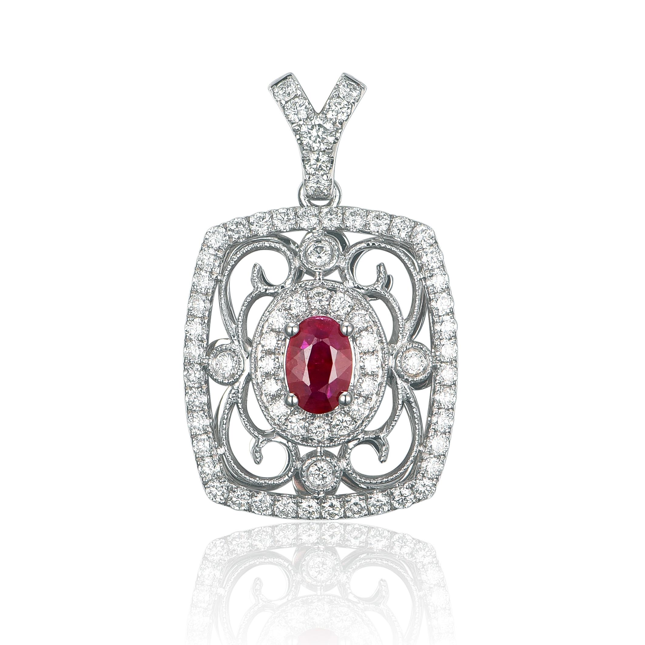 A gorgeous 6x4mm gorgeous red ruby, is surrounded with 0.88tcw G color, VS2 clarity , diamonds.