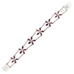 Ruby and Diamond Flower Bracelet in White Gold