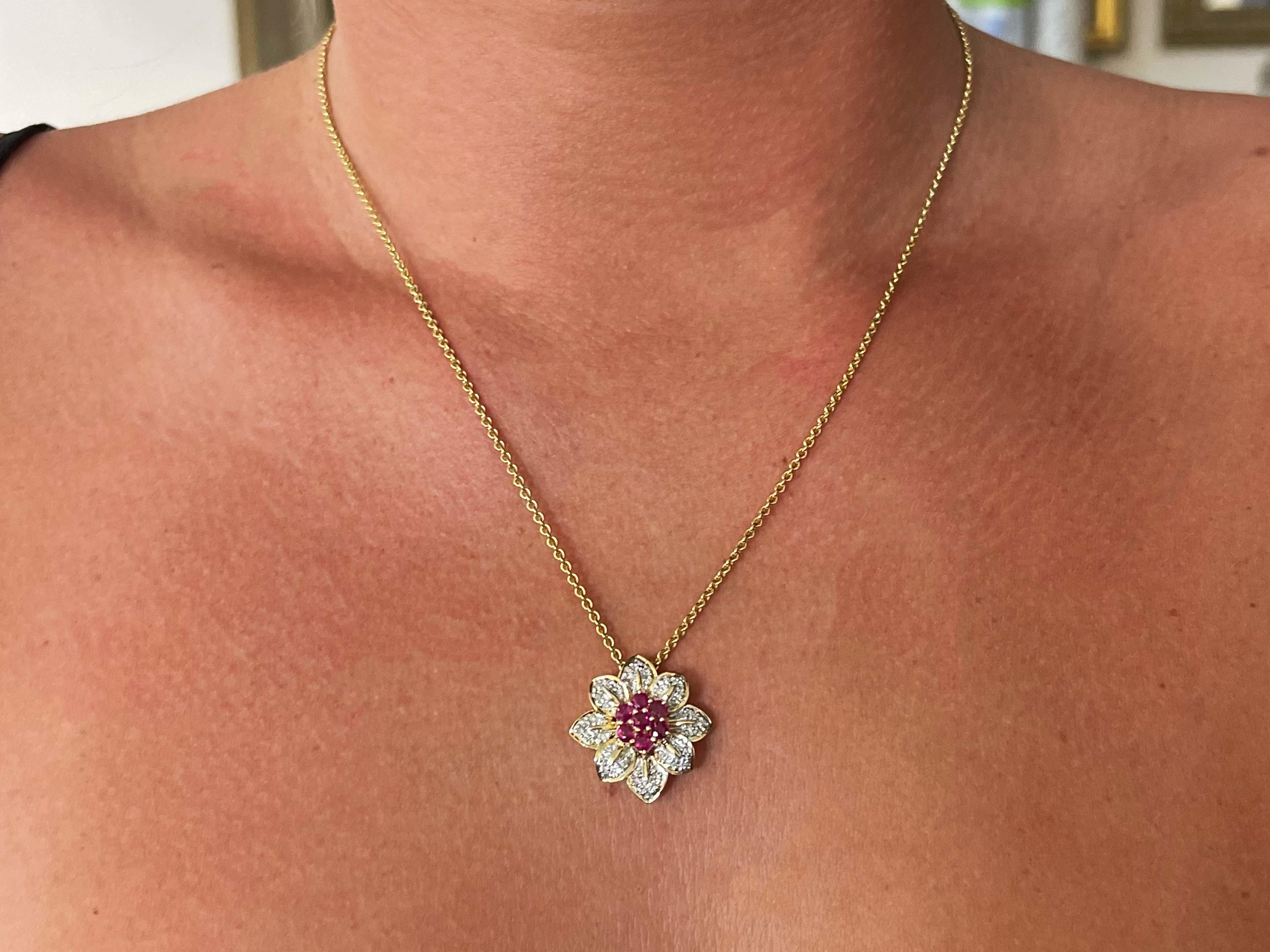 Ruby and Diamond Flower Necklace Solid 18k Yellow Gold
Item Specifications:

Necklace Metal: 18k Yellow Gold

Total Weight: 10.5 Grams

Chain Length: 20
