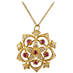 Ruby and Diamond Flower Pendant on 9 Carat Yellow Gold Chain