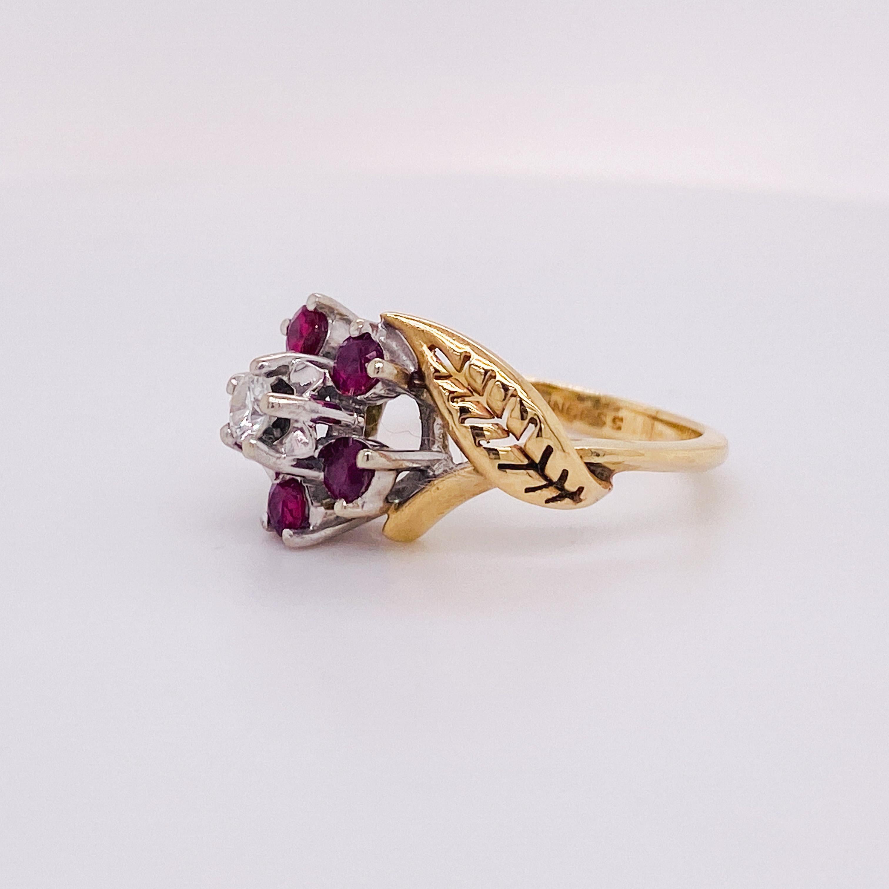 This graceful ruby flower ring demonstrates femininity and romance with its floral design! Light filters through the open design of the flower and pierced leaf that curves around the flower. For your ruby love, the rich purple-red colors of the