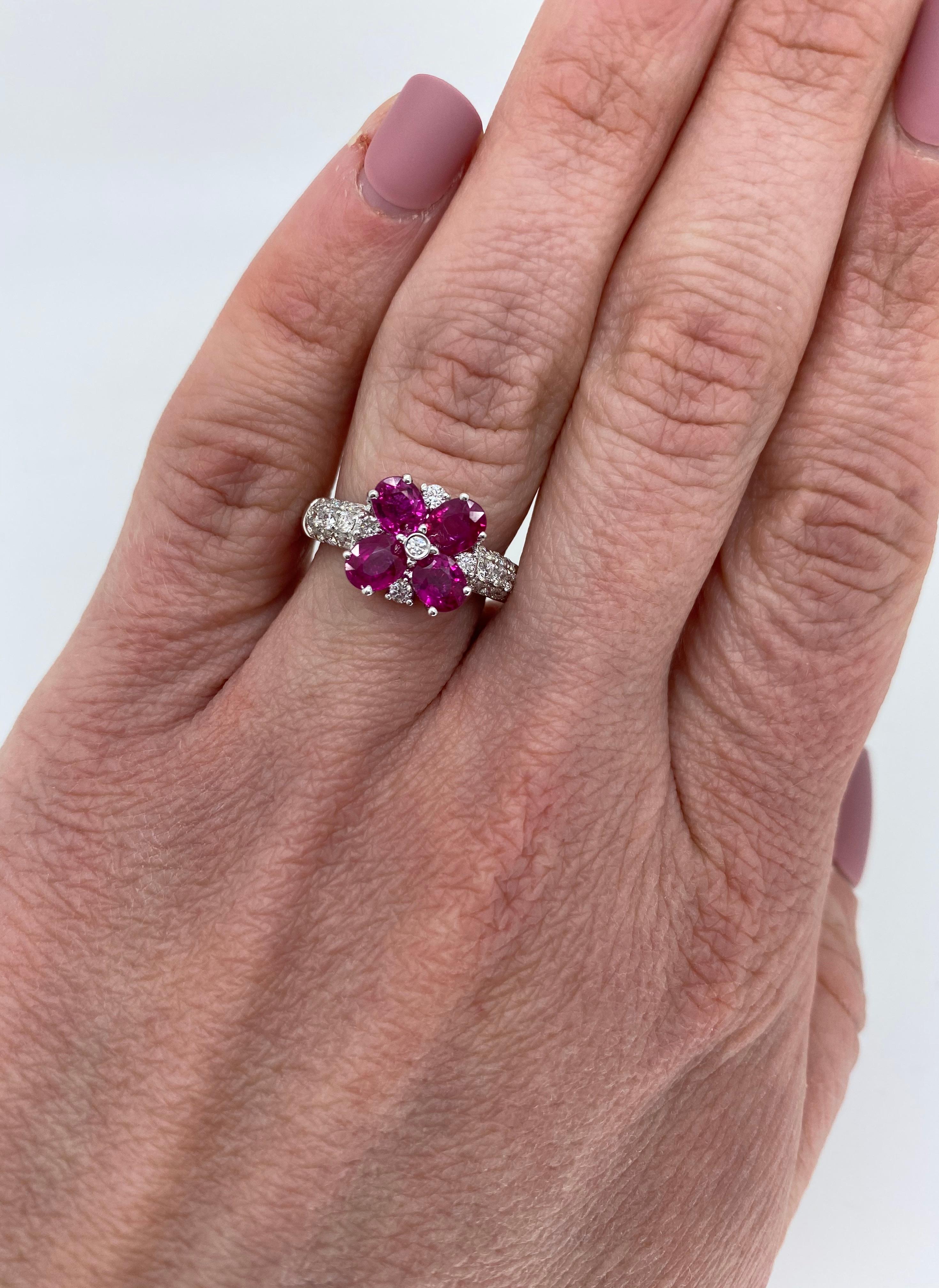 Floral designed ruby and diamond ring crafted in 18k white gold 

Gemstone: Ruby & Diamonds
Gemstone Carat Weight:  Approximately 1.77CTW
Diamond Carat Weight:  Approximately .48CTW
Diamond Cut: Round Brilliant Cut
Color: Average G-H
Clarity: