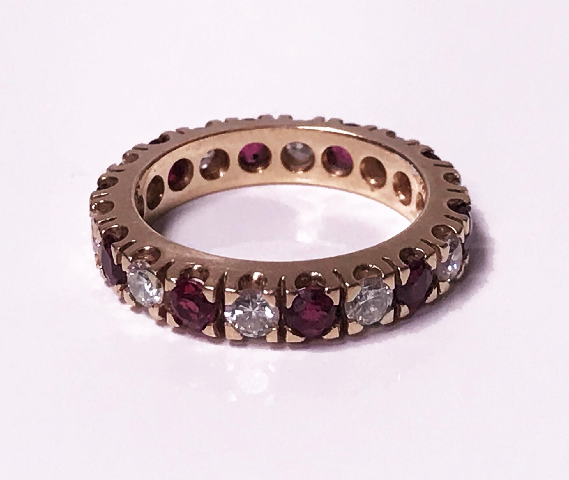 Ruby and Diamond Eternity Ring 14Kyellow gold. The ring set with 10 round brilliant cut diamonds, total diamond weight approximately 0.73 ct, average VS2-SI1 clarity, average H colour and ten medium moderately strong purplish Red Rubies, total ruby