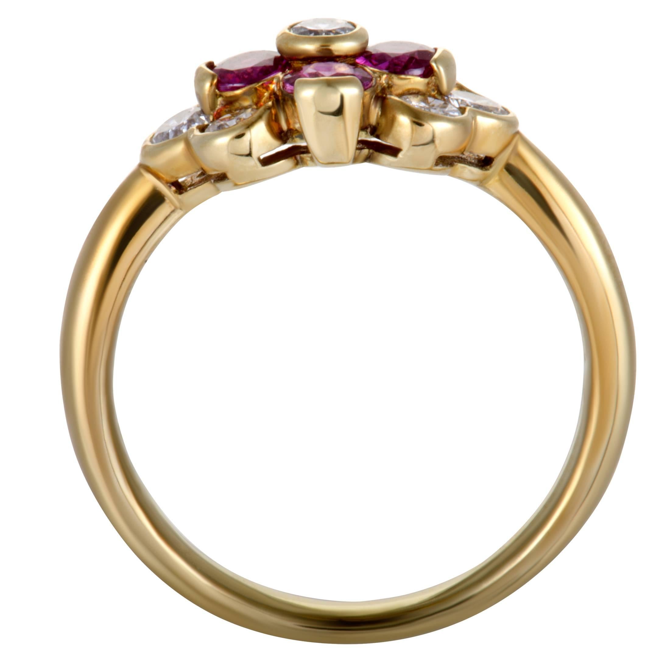 Endearingly dainty and feminine, this gorgeous ring made of 18K yellow gold features imaginative design and eye-catching décor. The ring is set with glistening diamonds and captivating rubies that weigh in total 0.44 and 0.58 carats