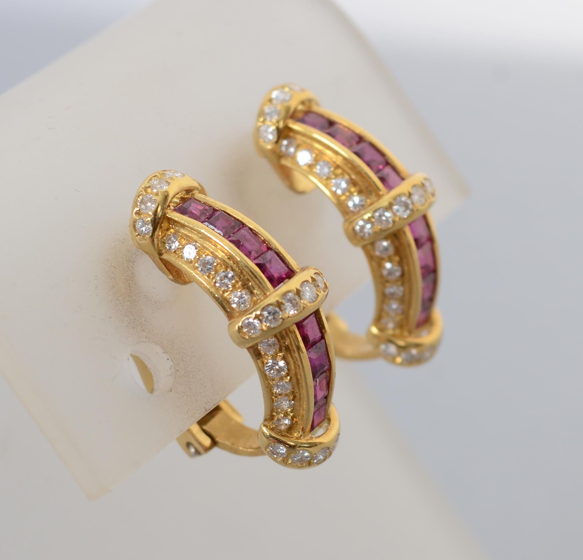 Beautiful half hoop earrings of calibre cut rubies flanked by round diamonds. The rubies are from Burma. The diamonds are H color; VS quality. The earrings have clip backs that can be modified to posts. They are half an inch wide and 15/16