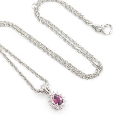 Ruby and Diamond Halo Drop Pendant in Platinum