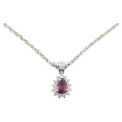Ruby and Diamond Halo Drop Pendant in Platinum