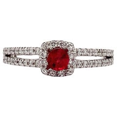 Ruby and diamond halo engagement ring 18k white gold