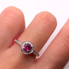 Ruby and diamond halo engagement ring platinum
