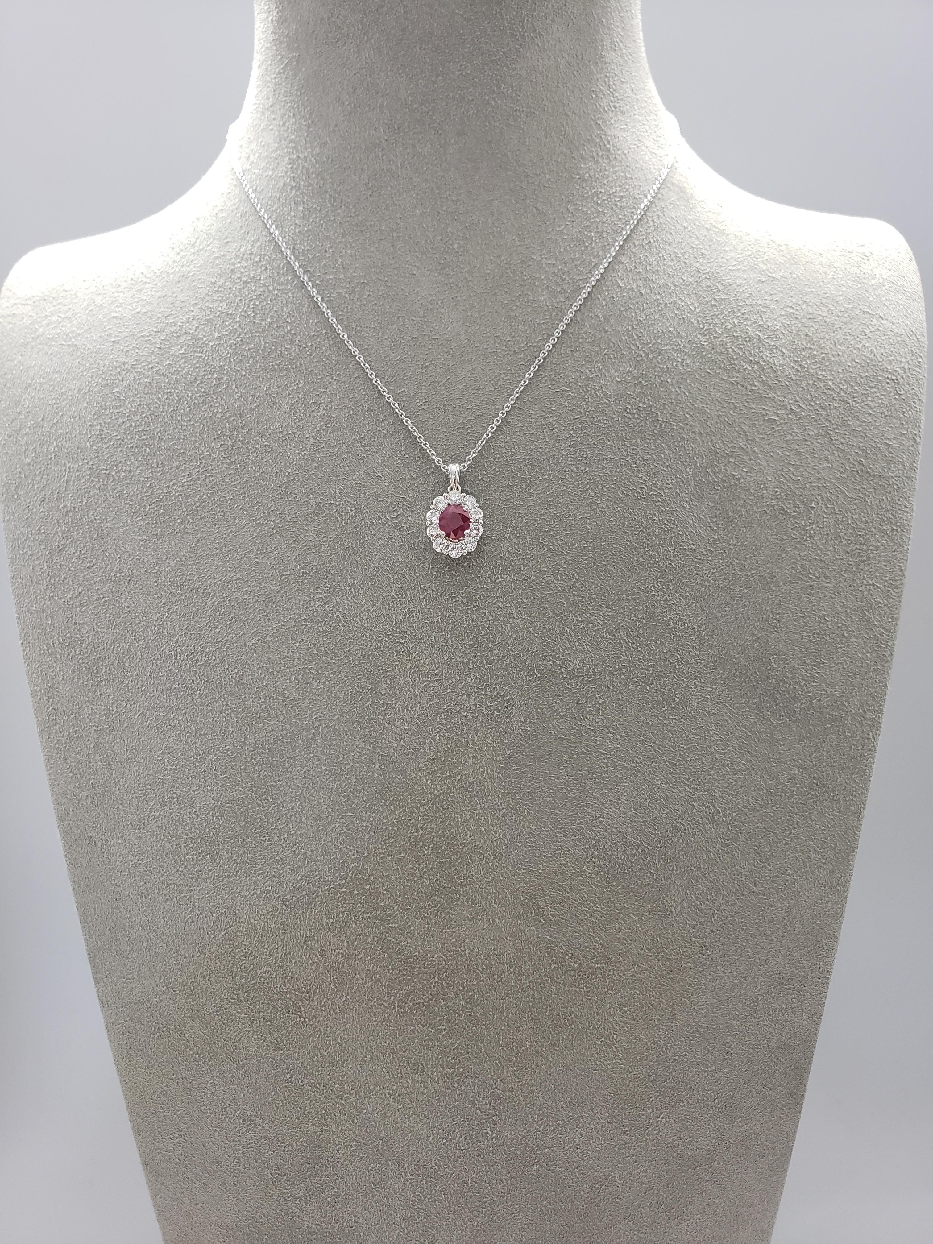 Showcasing a color-rich oval cut ruby weighing 1.04 carats, accented by a single row of round brilliant diamonds. Diamonds weigh 0.72 carats total. Set in 18 karat white gold. 

Style available in different price ranges. Prices are based on your