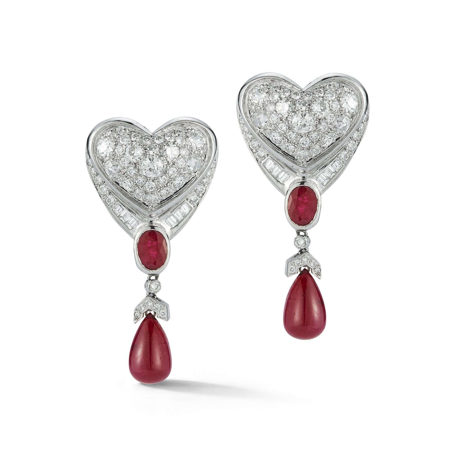 Ruby & Diamond Heart Drop Earrings, set with old mine diamonds. Circa 1990
Gold Type: 14K White Gold 
Back Type: clip on with post
Measurements: 1.75” long

