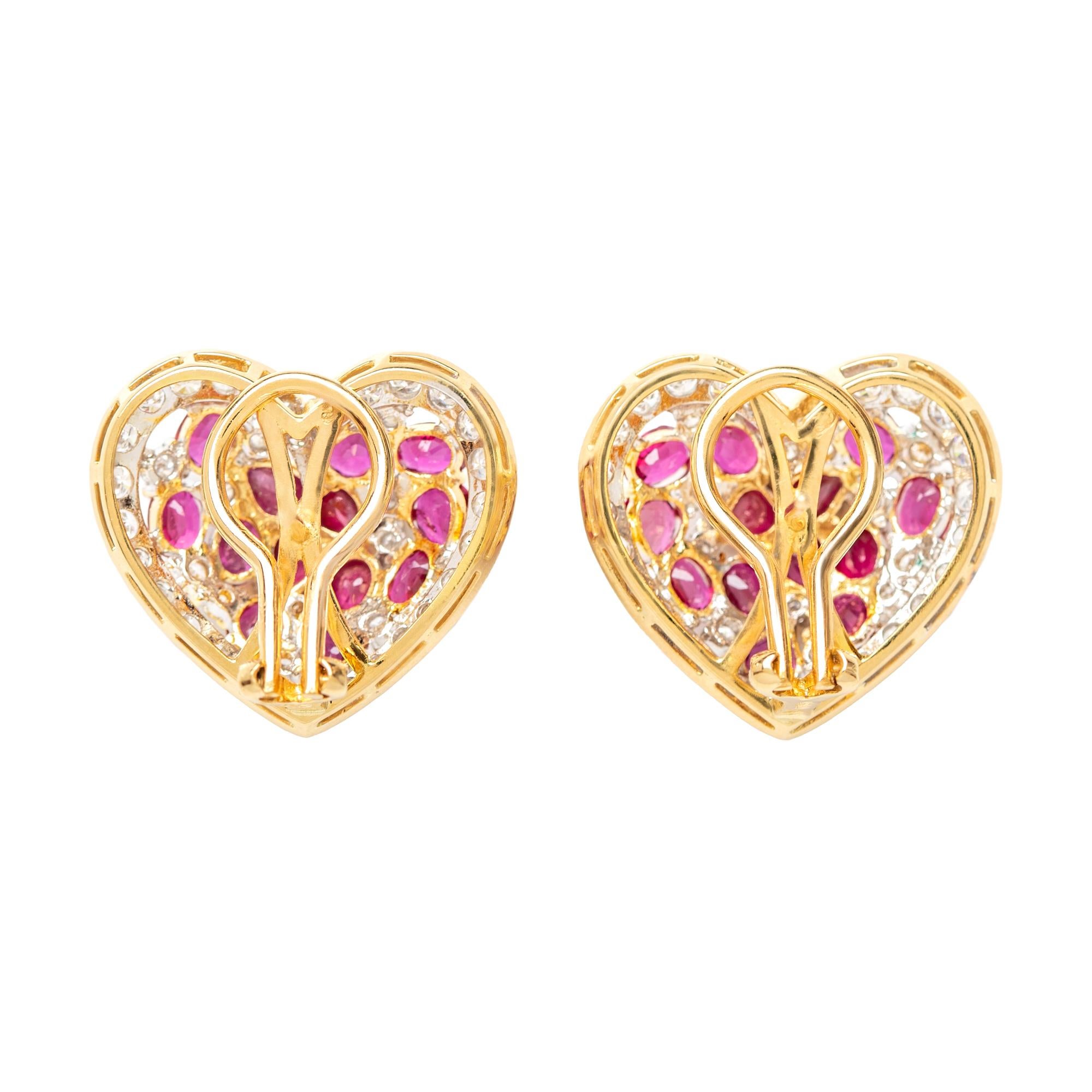 Heart-shaped ear clips are set with oval and pear-shaped ruby clusters accented by round brilliant-cut diamond surrounds. 

26 pear and oval cut rubies weighing a total of approximately 7.30 carats
82 full-cut diamonds weighing a total of