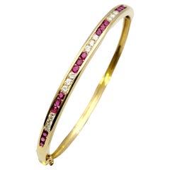 Ruby and Diamond Hinged Narrow Bangle Bracelet in 14 Karat Yellow Gold