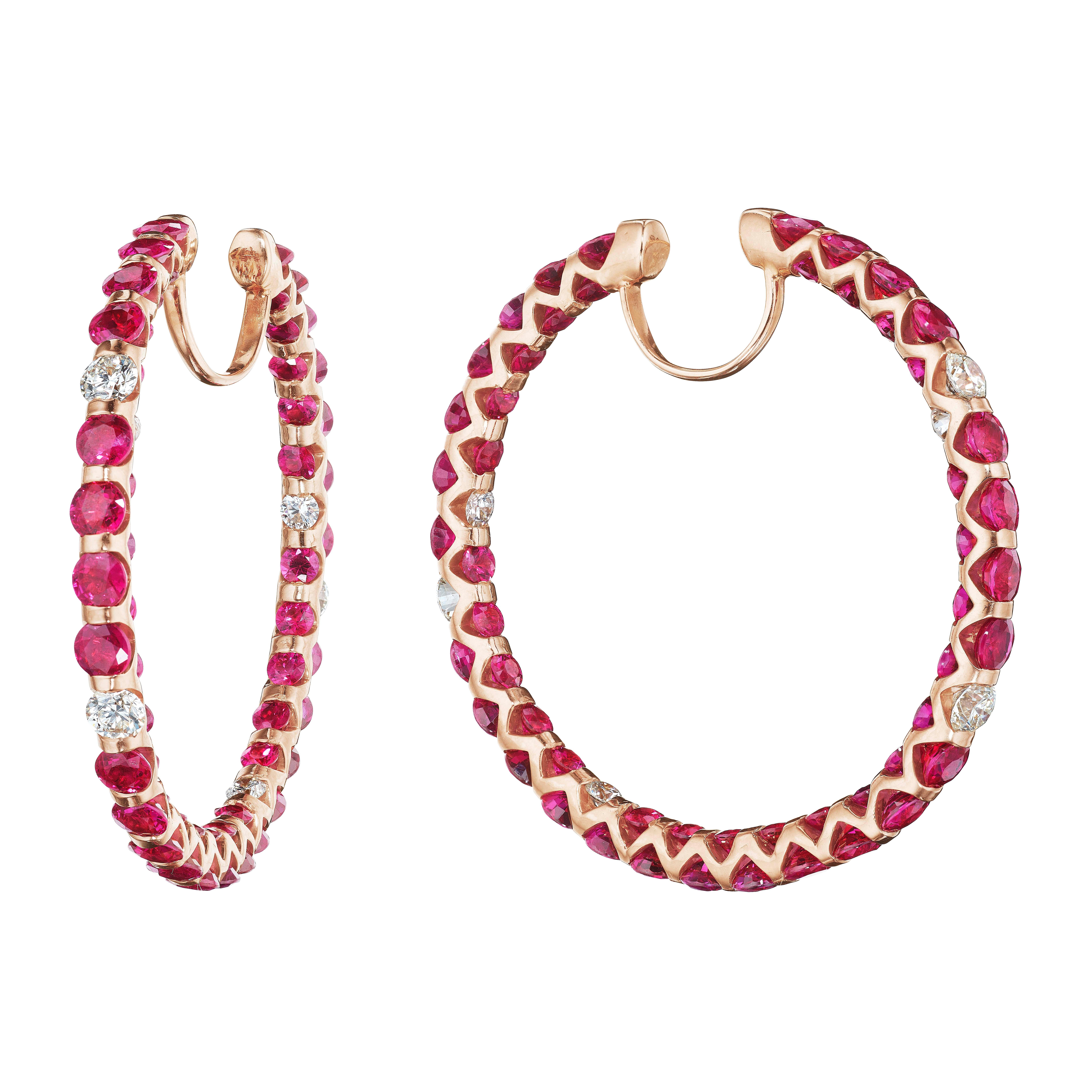 Gorgeous Pair of Ruby and Diamond Hoop Earrings.
Rubies set inside out with no more space to put another stone.
106 Round Rubies weighing 19.50 Carats.
12 Round Diamonds weighing 1.70 Carats.
Set in 18 Karat Rose Gold.
