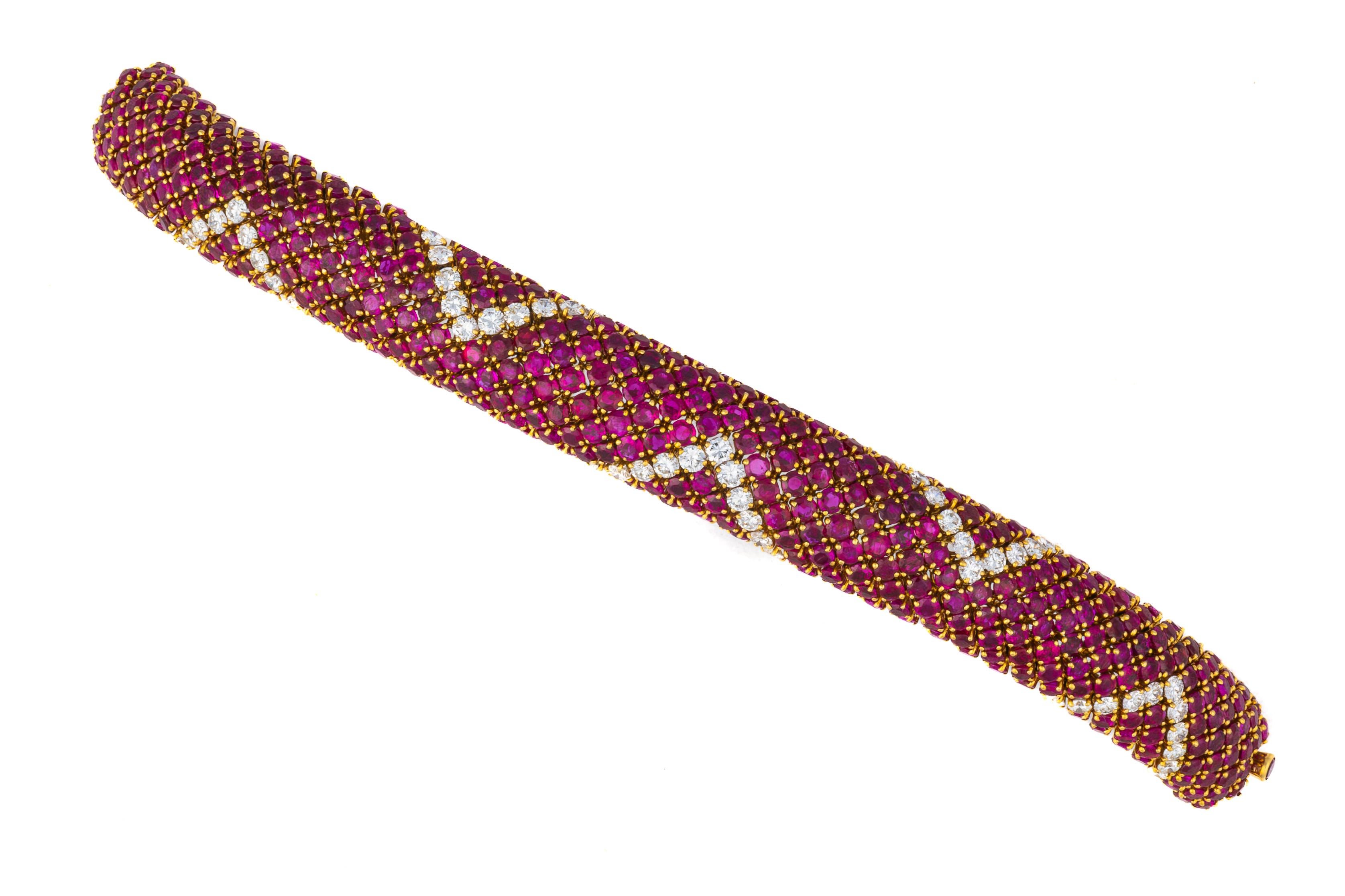 Ruby and Diamond Lattice Bracelet in 18K Yellow Gold

Description:
This striking bracelet is composed of a richly woven lattice of round-cut rubies, each individually prong-set in 18K yellow gold, accented by dazzling waves of round brilliant-cut