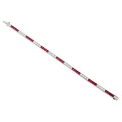 Ruby and diamond line bracelet, American, circa 1935.