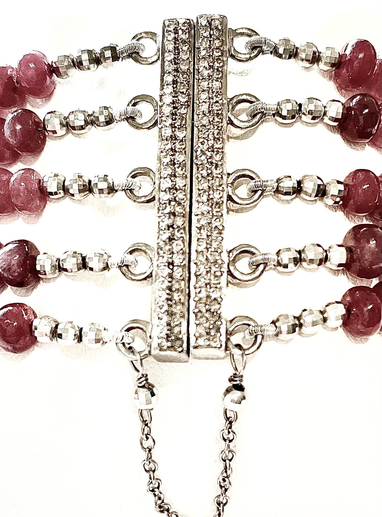 Description
Rubies 352 carats, pave diamond centerpiece. Unique, strong magnetic pave diamond clasp for ease of use, secured with a safety chain, 5 strand bracelet.                    
Item # B1213
Check out matching necklace and ring, see last