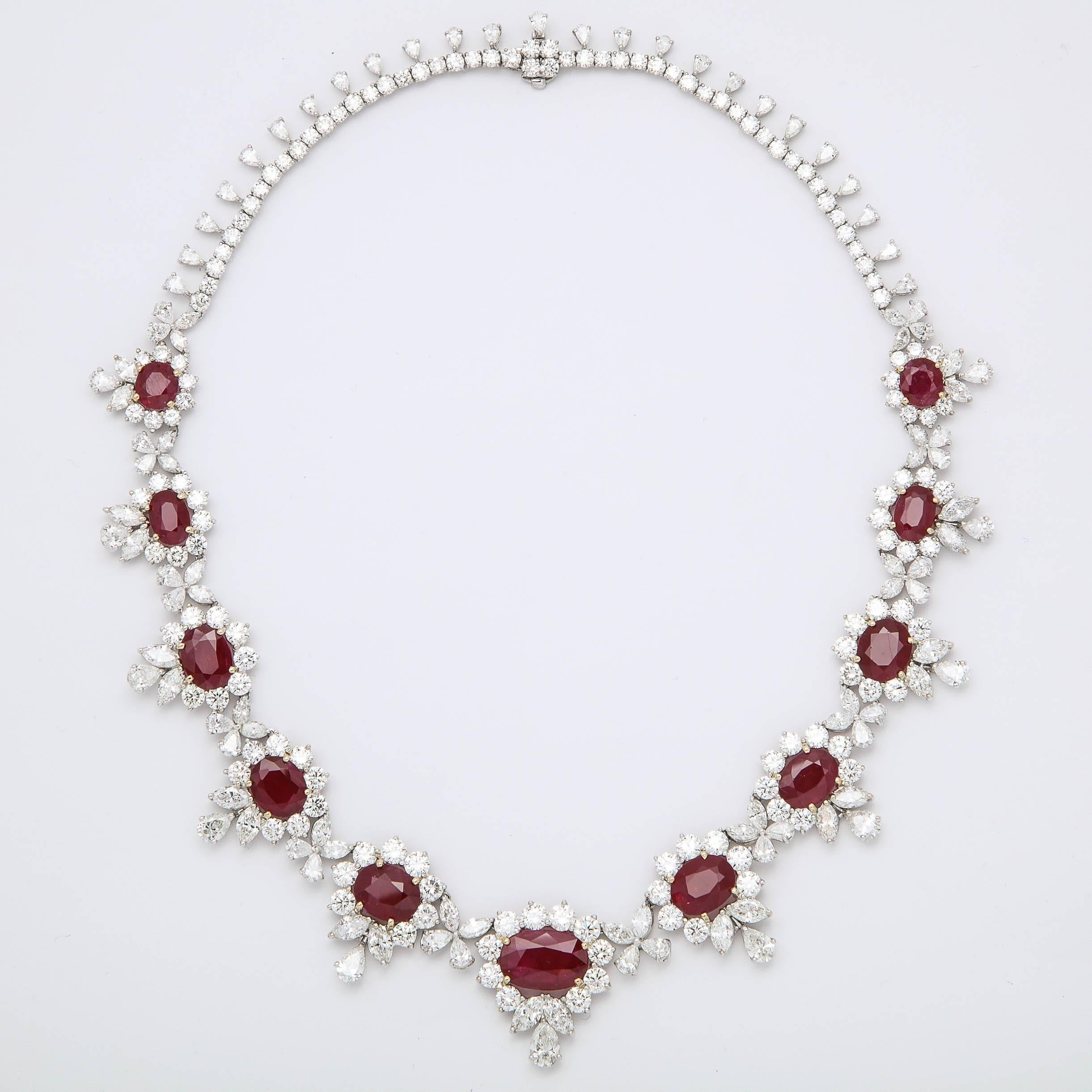 
A beautiful ruby and diamond necklace.

32.38 carats of magnificent brilliant red ruby, fine quality.

46.07 carats of white diamonds, pear, marquise and round shapes. 

18k white gold 

16 inch length -- can be adjusted if necessary. 

The