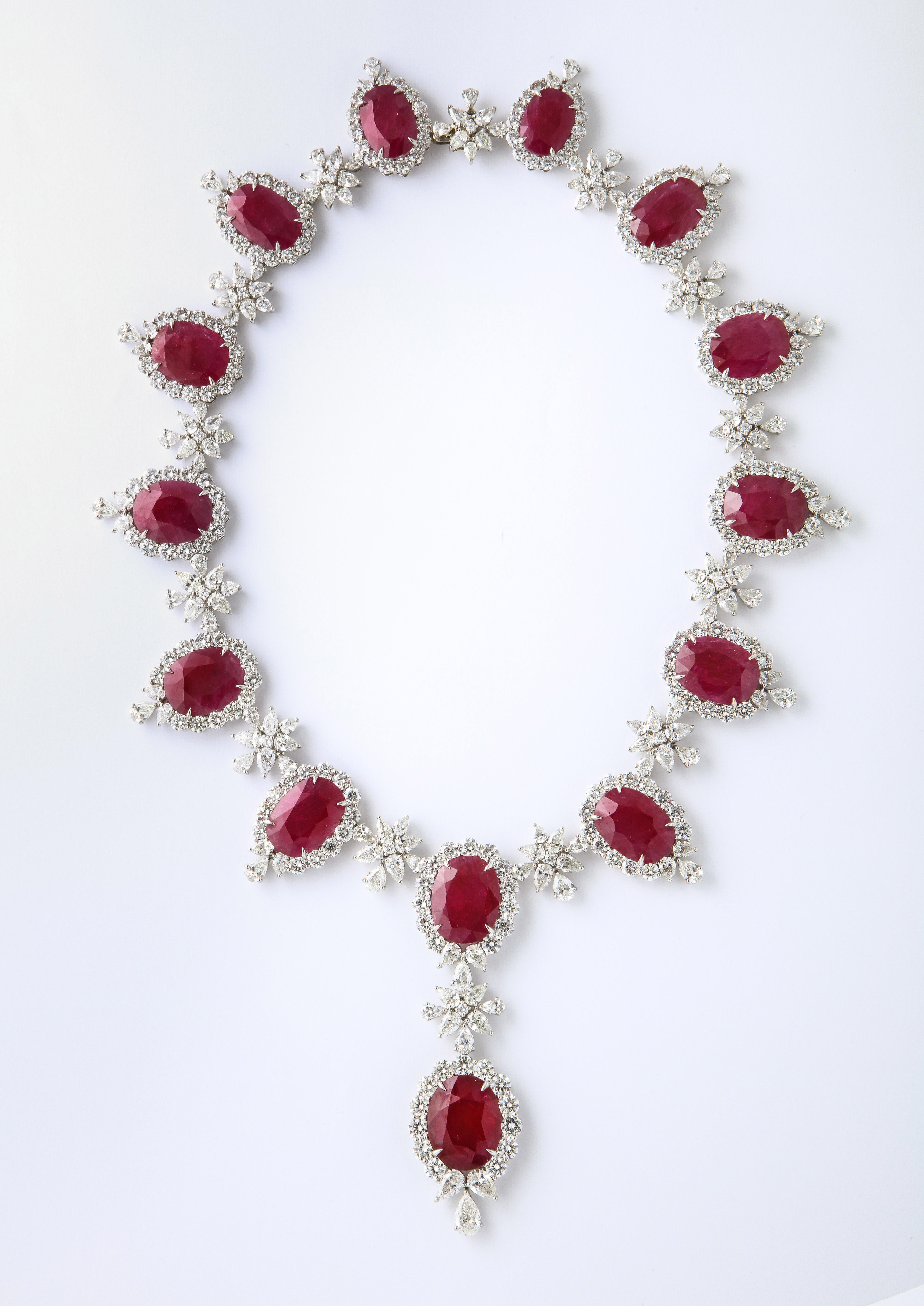 
An Important Ruby and Diamond Necklace 

209.10 carats of certified “Intense Red” Ruby

92.43 carats of colorless round, pear and marquise cut diamonds 

Set in Platinum 

17.5 inch length, the center piece measures approximately 3.25 inches