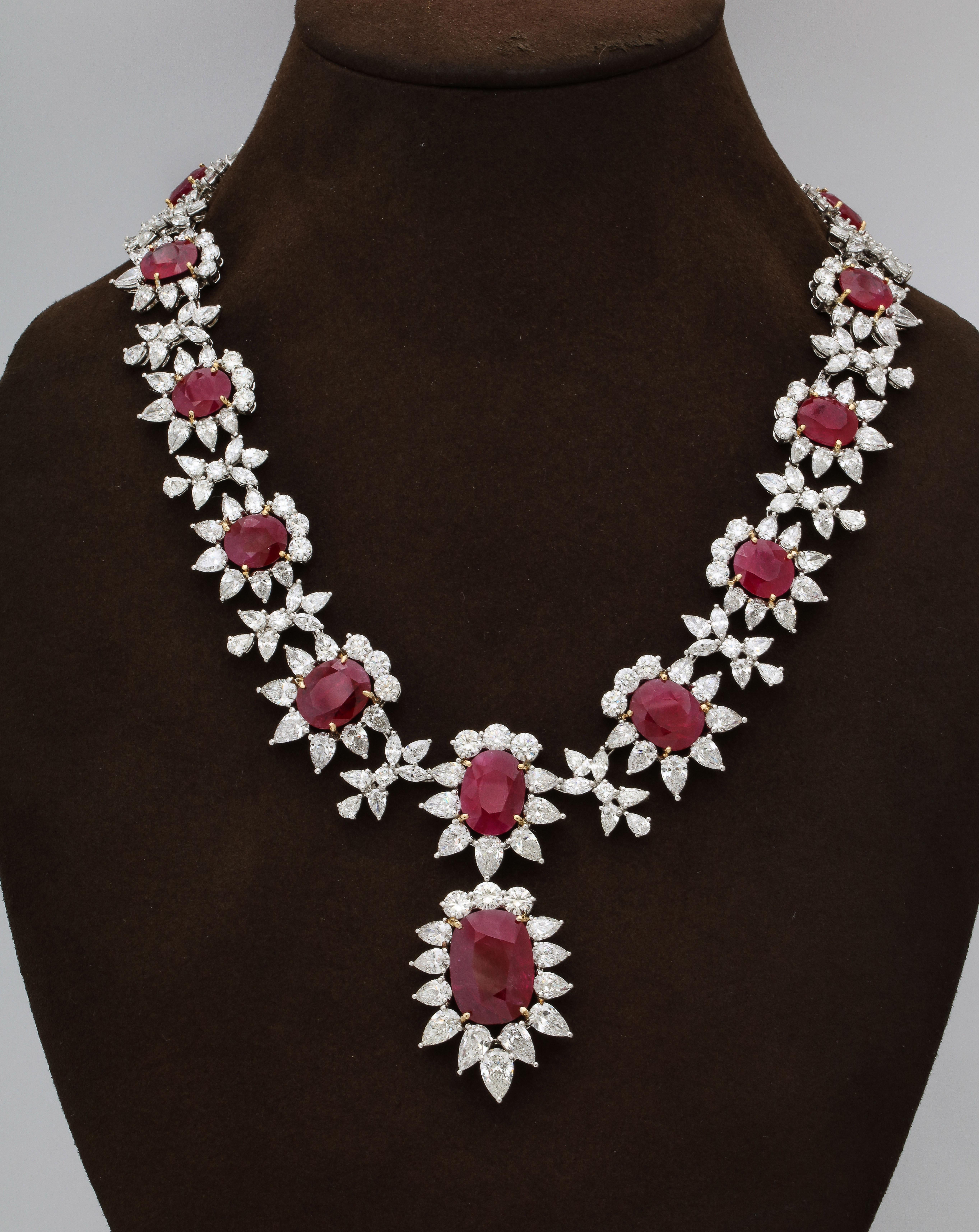 
An Important and Spectacular Piece.

93.78 carats of Certified Intense Red Rubies. 

69.49 carats of colorless white round, pear and marquise shape diamonds. 

Set in platinum with 18k yellow gold prongs. 

17 inch length. The center drop measures