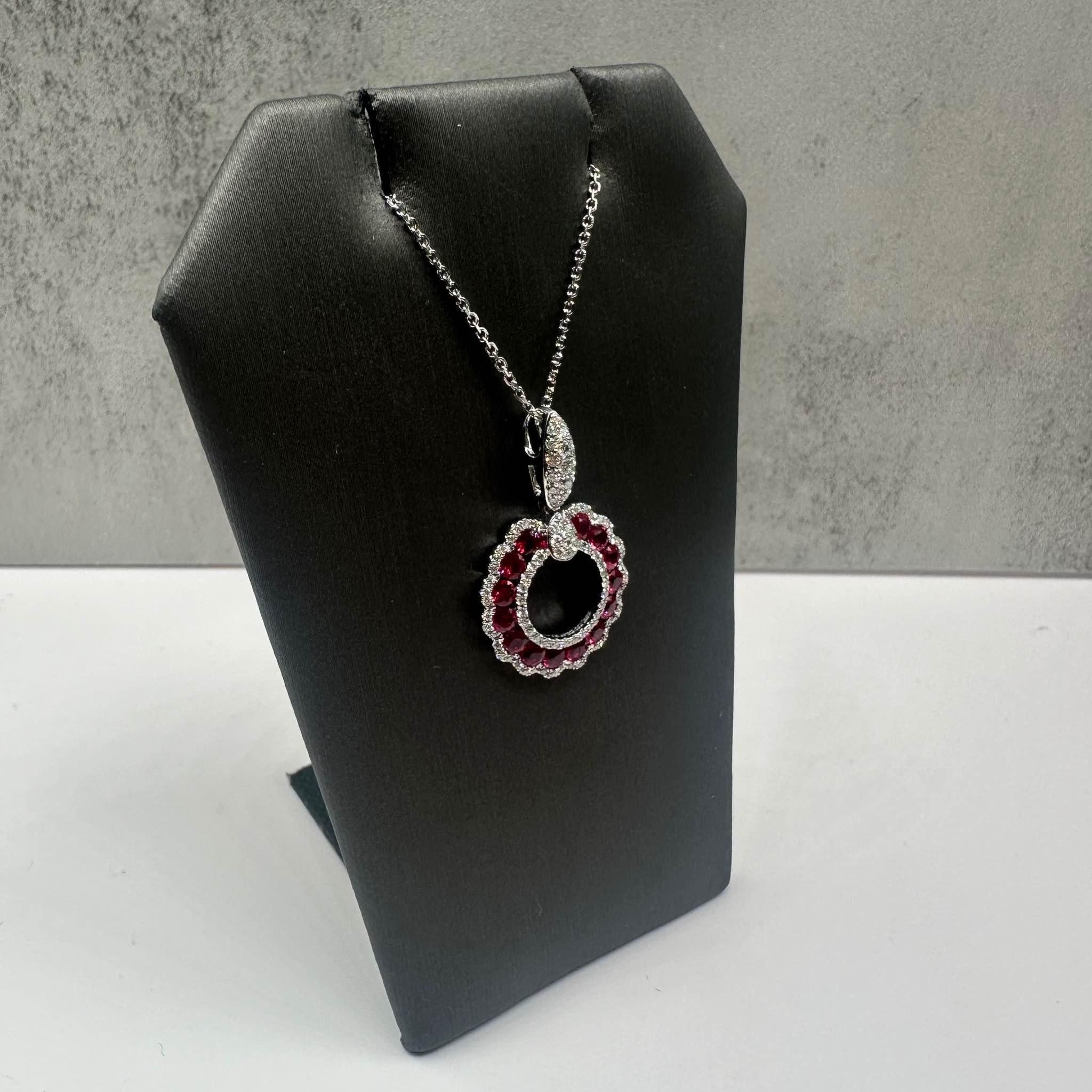 This stunning Ruby and Diamond Necklace in 14kt white gold combines vibrant rubies with the sparkle of natural GH VS/SI round diamonds, creating a timeless and elegant piece. Featuring approximately 0.25ctw of diamonds and (14) 2mm round rubies,