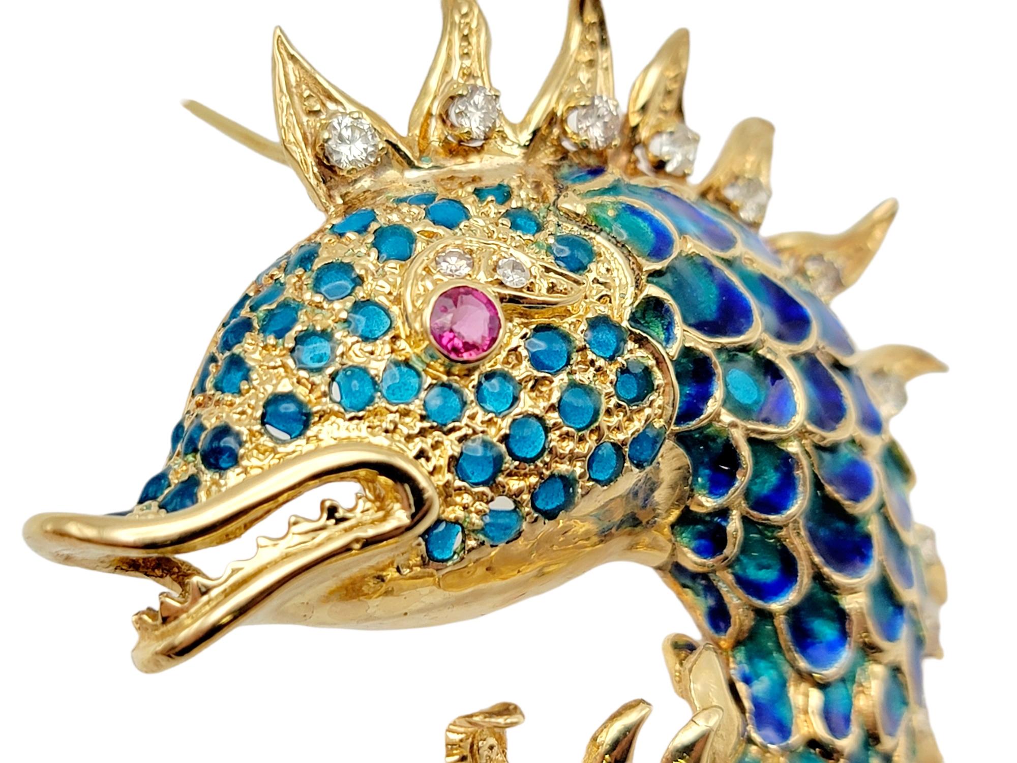This magnificent three dimensional scaled fish brooch will become a signature piece! From the rounded scaled fish body to the flowing fins and details like eyebrows and teeth, this brooch has every exquisite detail. 

This piece features .85 carats