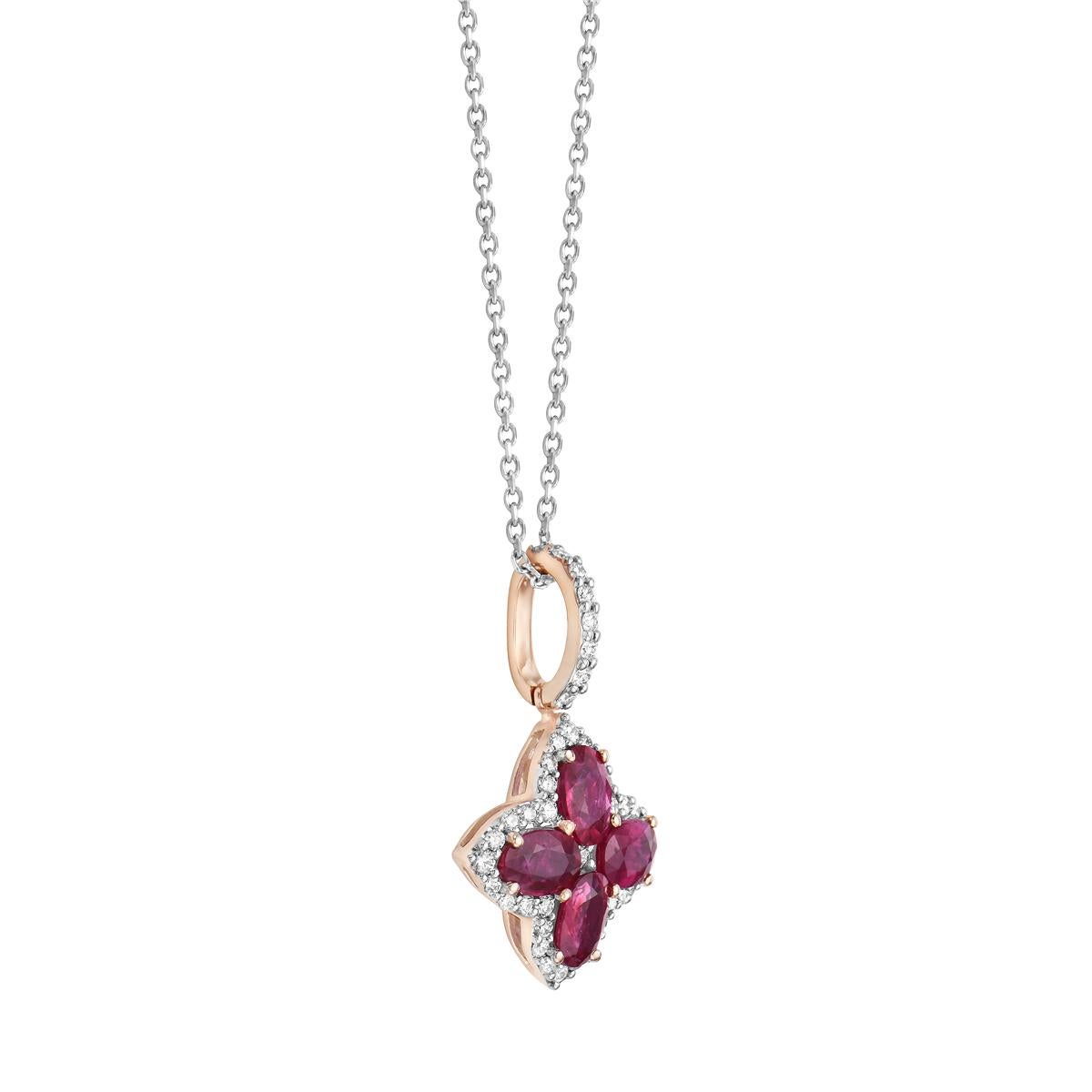 This beautiful pendant is made from 1.6 grams of 14 karat rose gold. The flower shape is made from 4 rubies totaling 2.3 carats and a total of 41 round diamonds totaling 0.42 carats, including SI1-SI2, GH color diamonds. A 14 karat 18-inch cable