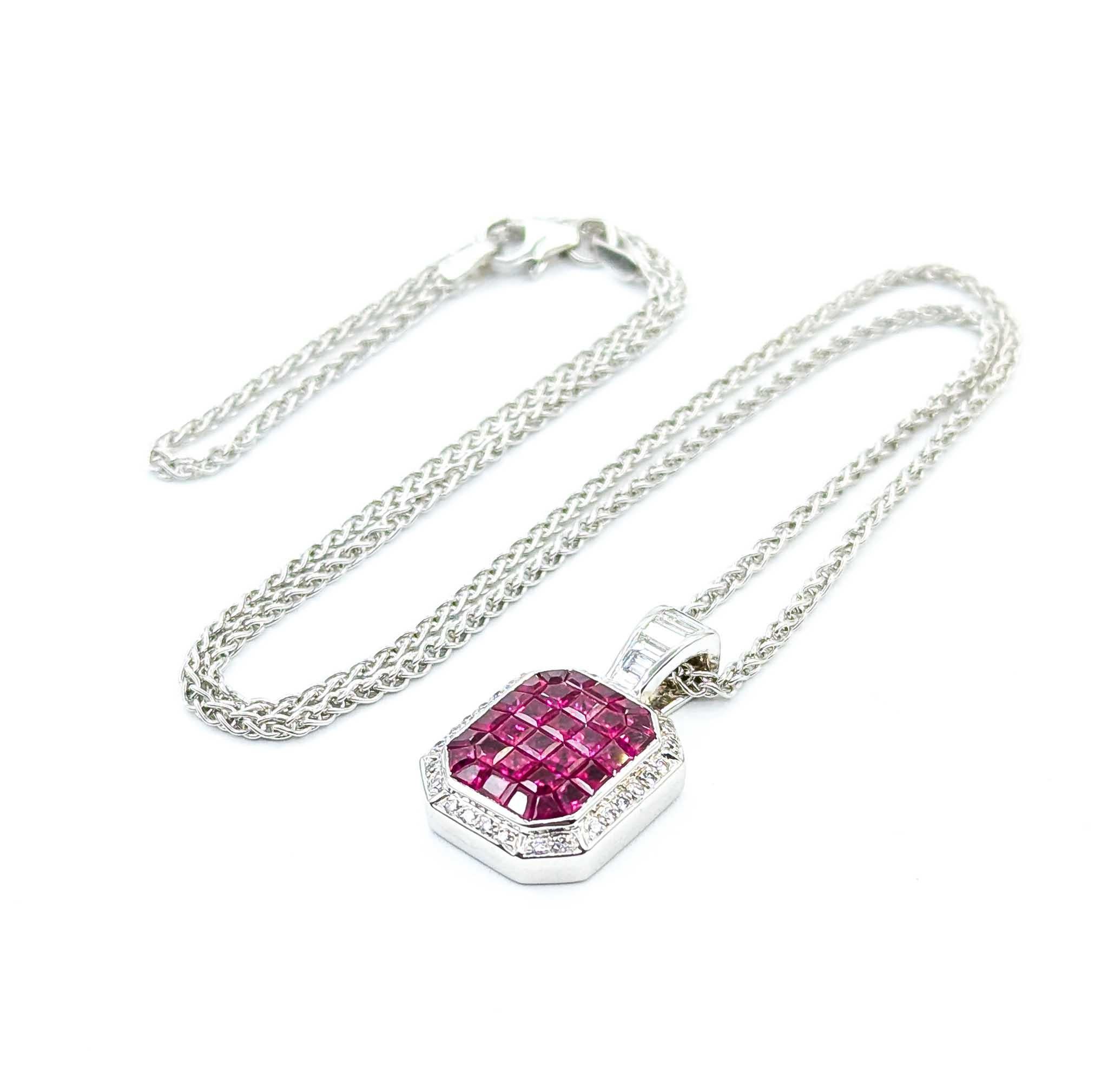 Introducing this exquisite ruby pendant with chain, crafted in luxurious 18k white gold. The pendant showcases an elegant invisible setting and is adorned with a captivating 2.00-carat ruby, offering a striking centerpiece. Surrounding the ruby are