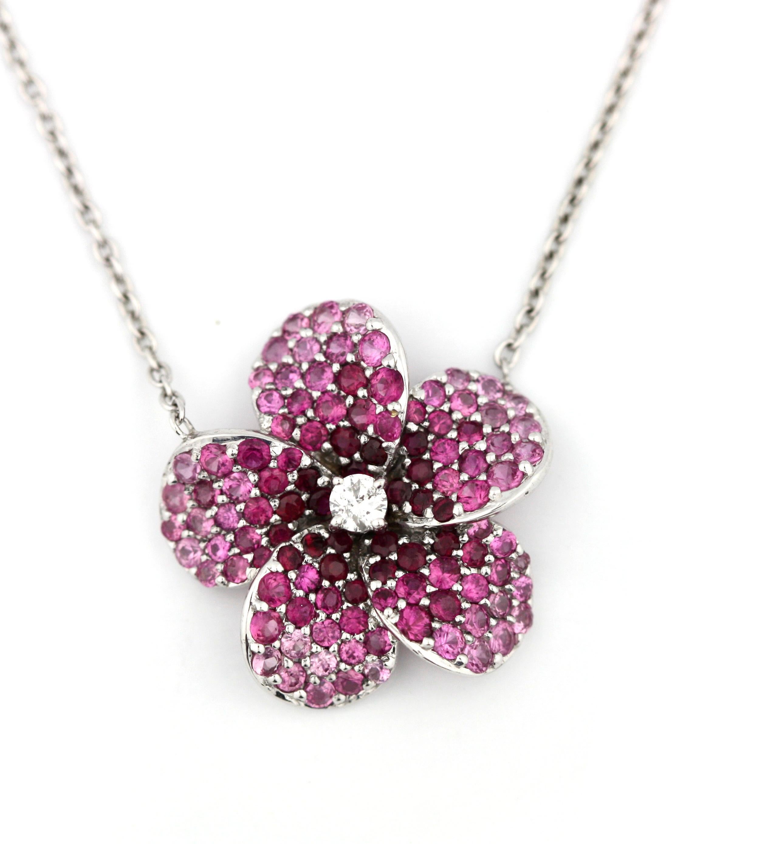 Ruby and Diamond Pendant-Necklace
Of flower design, centering a single-cut diamond, accented by rubies, completed by a white gold chain. Rubies weighing approximately 1.86 carats
Length 18 inches, 18 karat white gold
Condition Report
In good