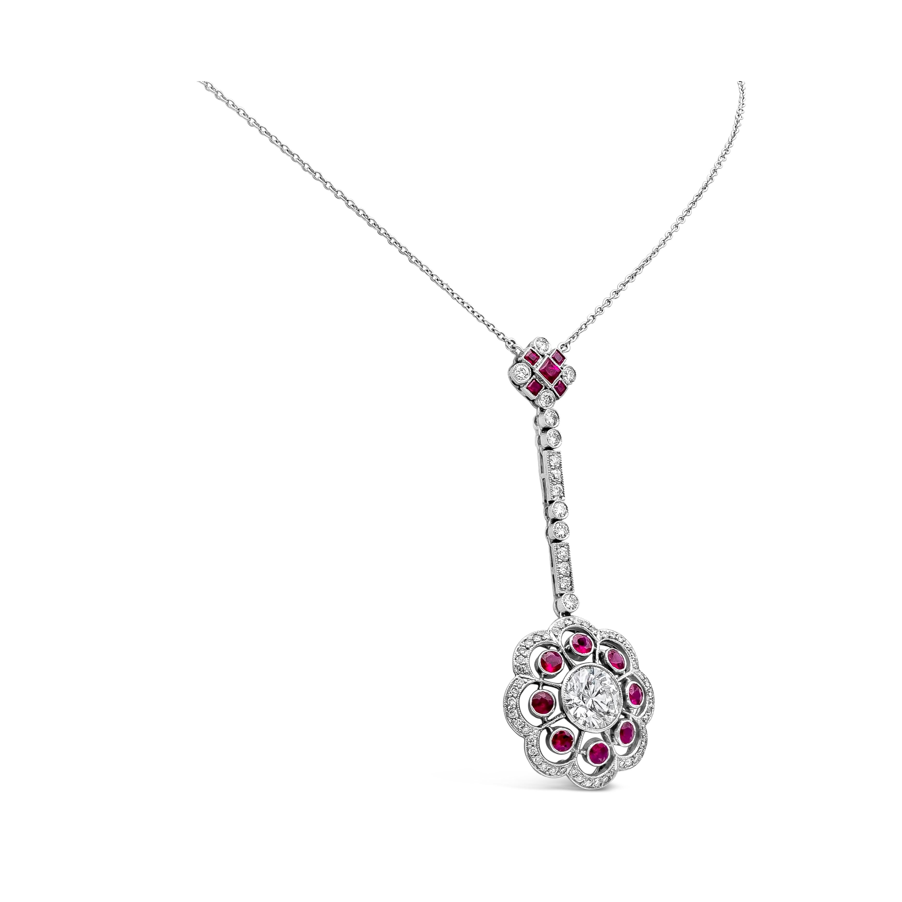 This beautiful vintage pendant drop necklace showcasing a round brilliant cut diamond center stone embellished with eight full-cut red rubies spaced evenly all around. Finished the floral-motif design with a diamond set in the outer layer. Spaced by