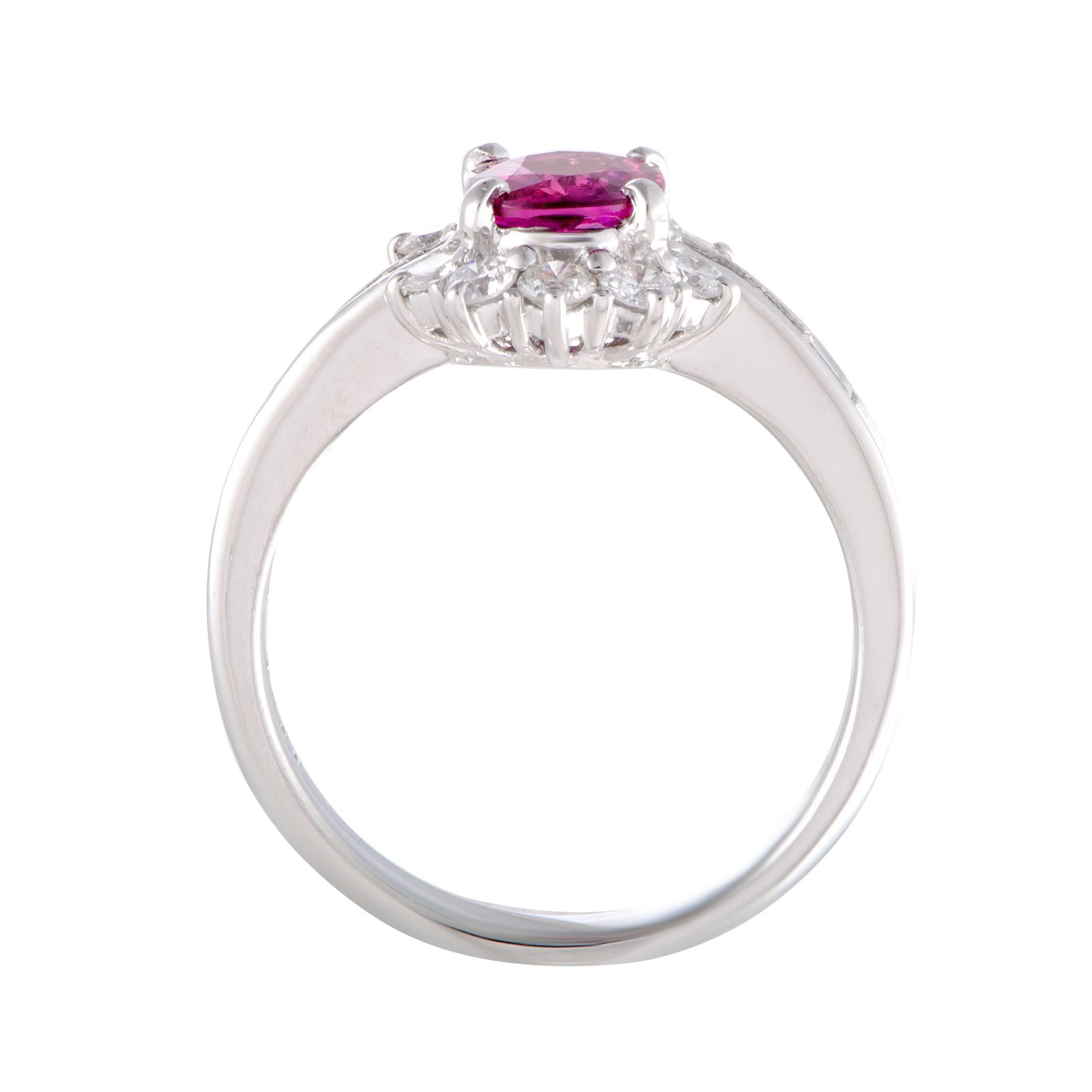 Gorgeously designed and beautifully decorated, this platinum ring boasts an exceptionally prestigious and fashionable appeal. The elegant ring is adorned with 0.53ct of stunning diamonds around a gorgeous ruby, weighing 1.01ct, that add glitz and