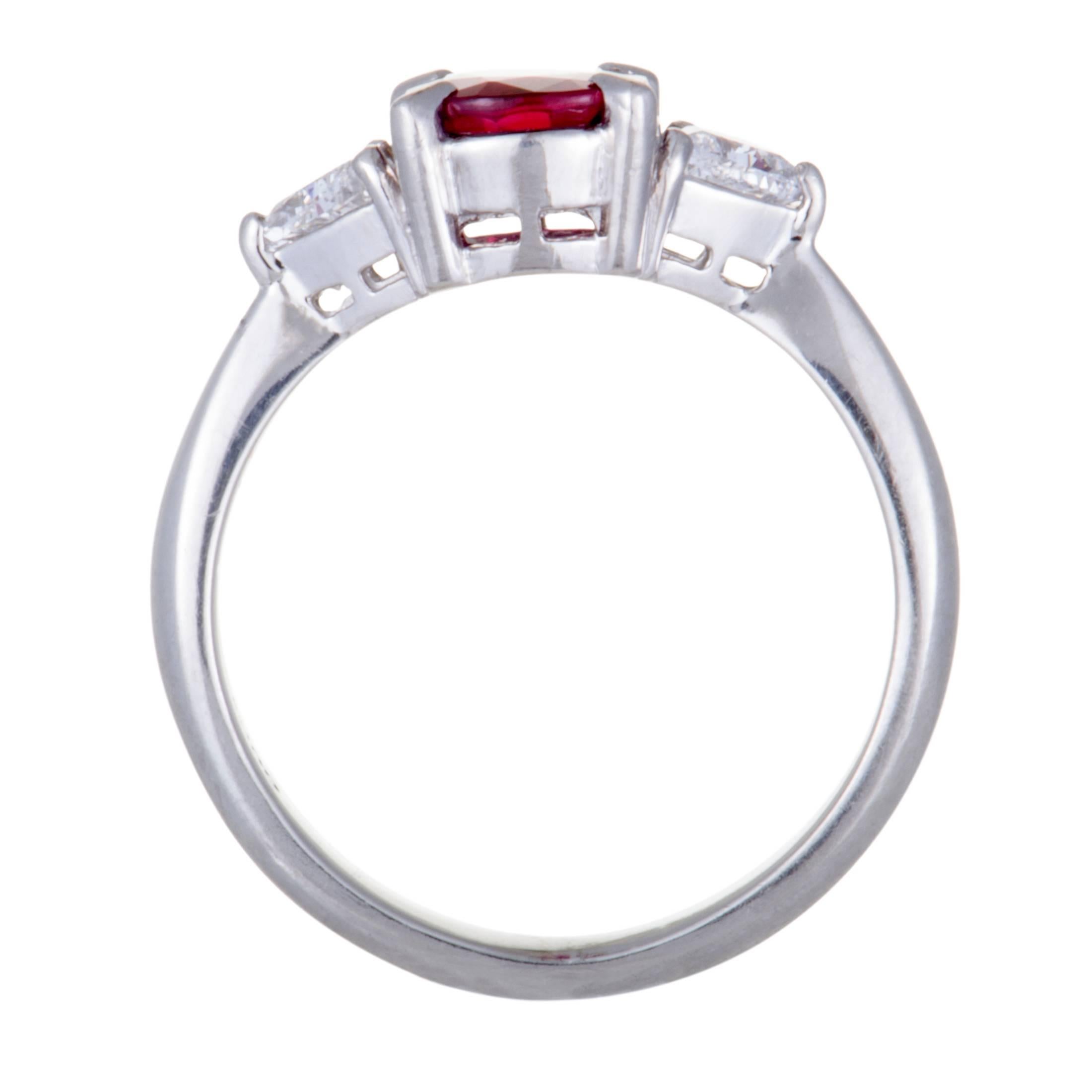 The captivatingly regal tone of ruby stands out magnificently against the bright gleam of platinum and sumptuous resplendence of diamonds in this delightfully classy ring. The ruby weighs 1.20 carats and the diamonds total 0.36 carats.
Ring Top