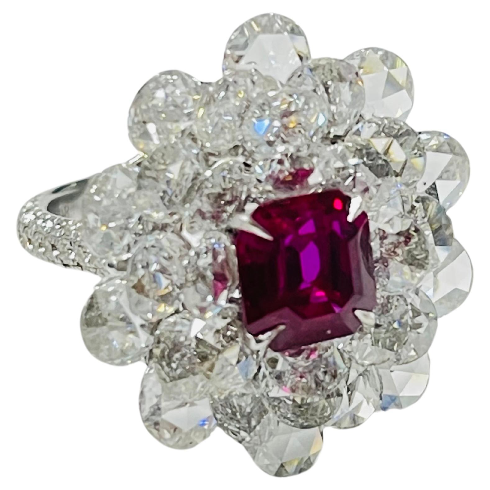 Cette bague unique en son genre présente un magnifique rubis non chauffé de Birmanie de 3,15 carats, certifié Gublin et GIA, niché dans un lit de magnifiques diamants blancs de taille rose pesant 4,54 carats /20 (4,7 mm) et 3,04 carats /10 (5 mm)