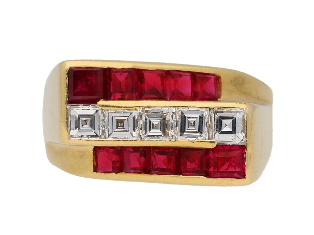Ruby and diamond ring by Oscar Heyman Brothers. Horizontally set with five square step cut diamonds in open back rubover channel settings with an approximate total weight of 0.80 carats, flanked on top and bottom with two single rows of ten square