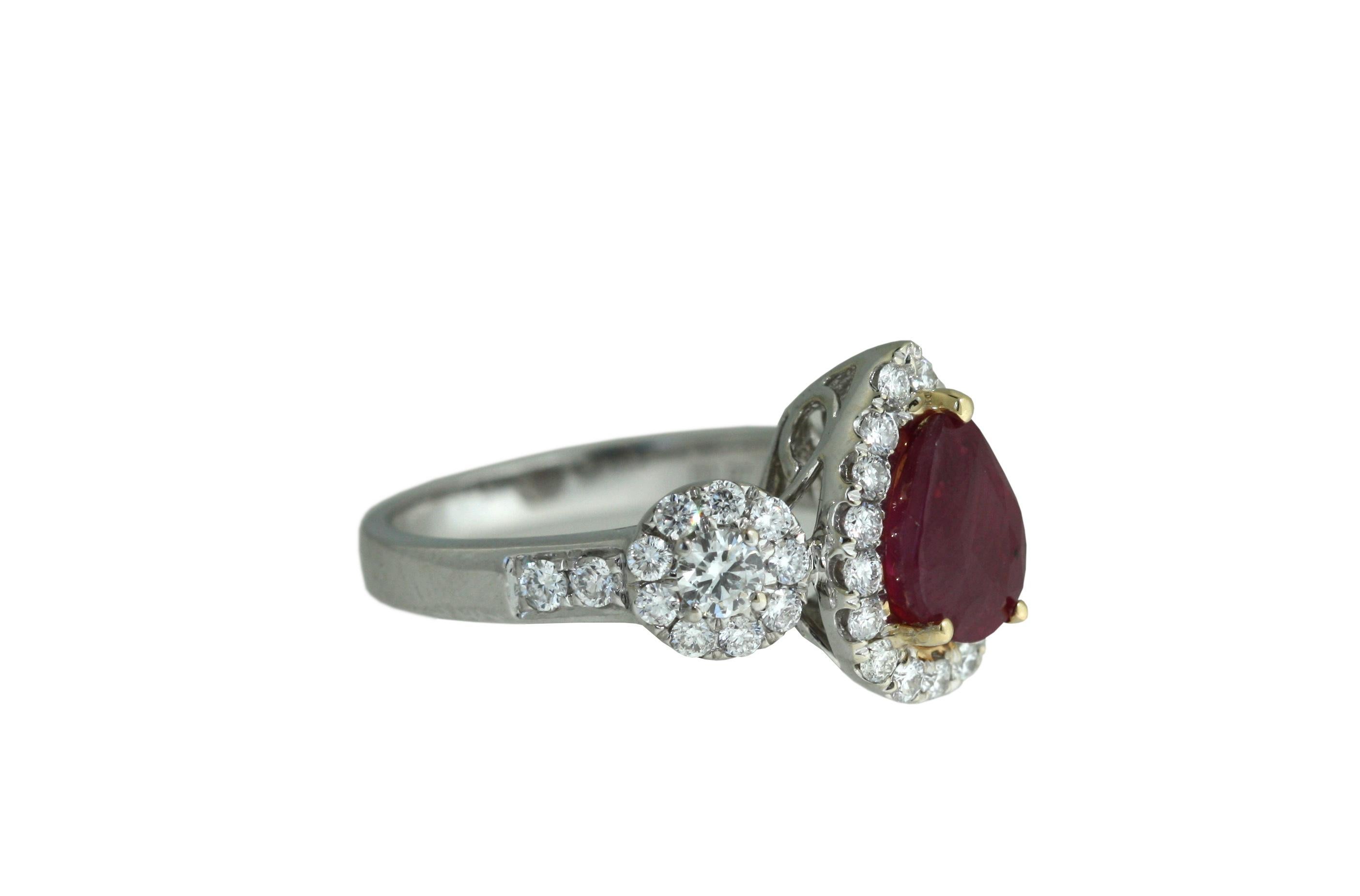 Ruby and Diamond Ring 
The pearl-shaped ruby weighing 3.03 carats, set within a mounting comprised of round diamonds, 
mounted in 18kt white gold 
6.9 grams (gross) , size 6 1/4