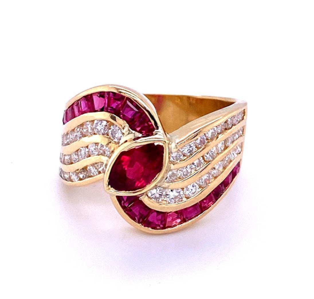 18 karat yellow gold 1980’s ring with natural rubies, and 0.50 carat total weight of I/J, SI diamonds. The ring is ⅝’’ wide at the top and tapers to 3/16’’ at the bottom, and rises 4.70 mm above the finger. 