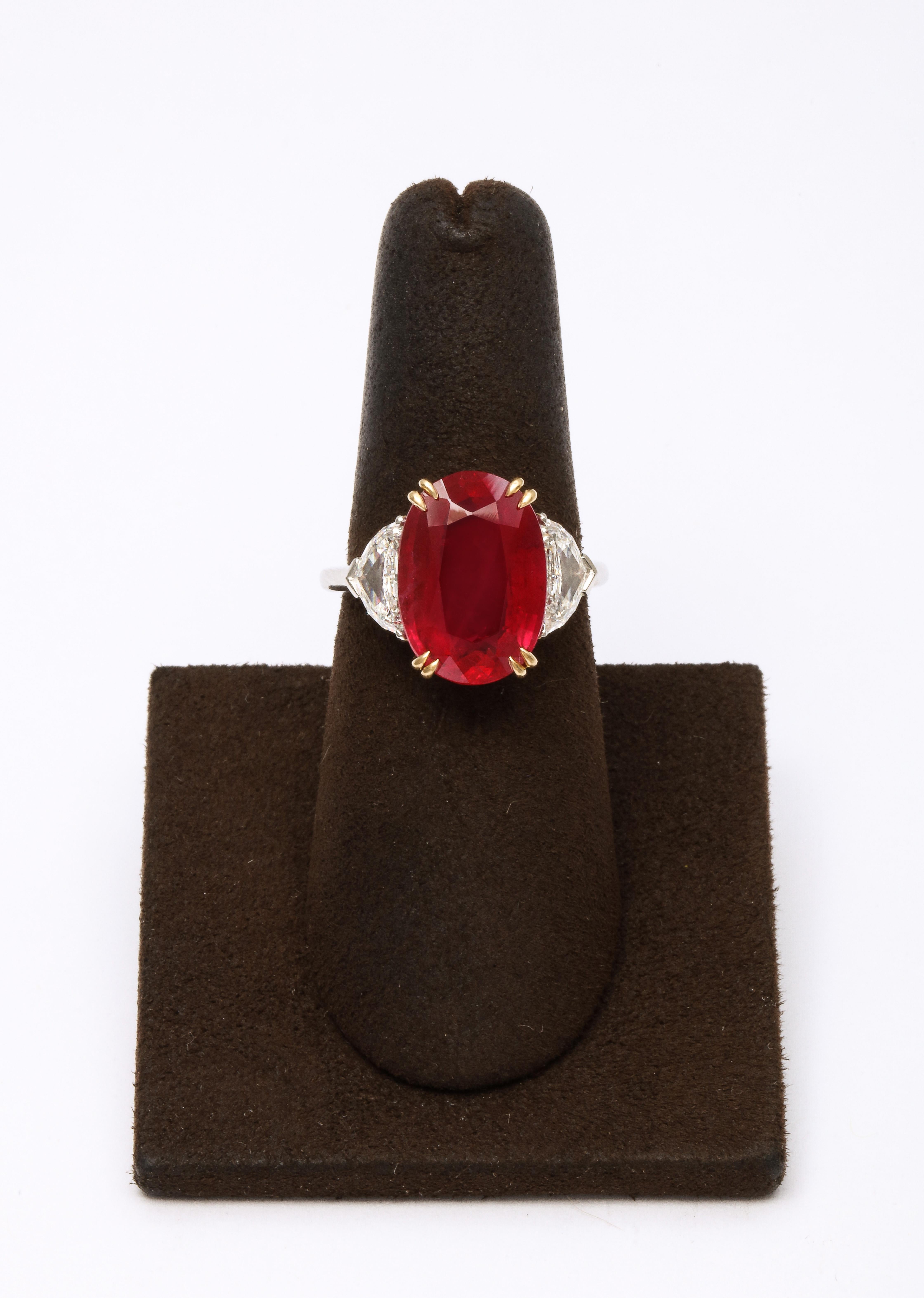 
A beautiful ring featuring a vibrant 7.63 carat Certified Fine Thai Ruby. 

Set in a handmade platinum and 18k yellow gold mounting with 1.02 carats of colorless white side diamonds.  

Size 6.25, this ring can be resized. 