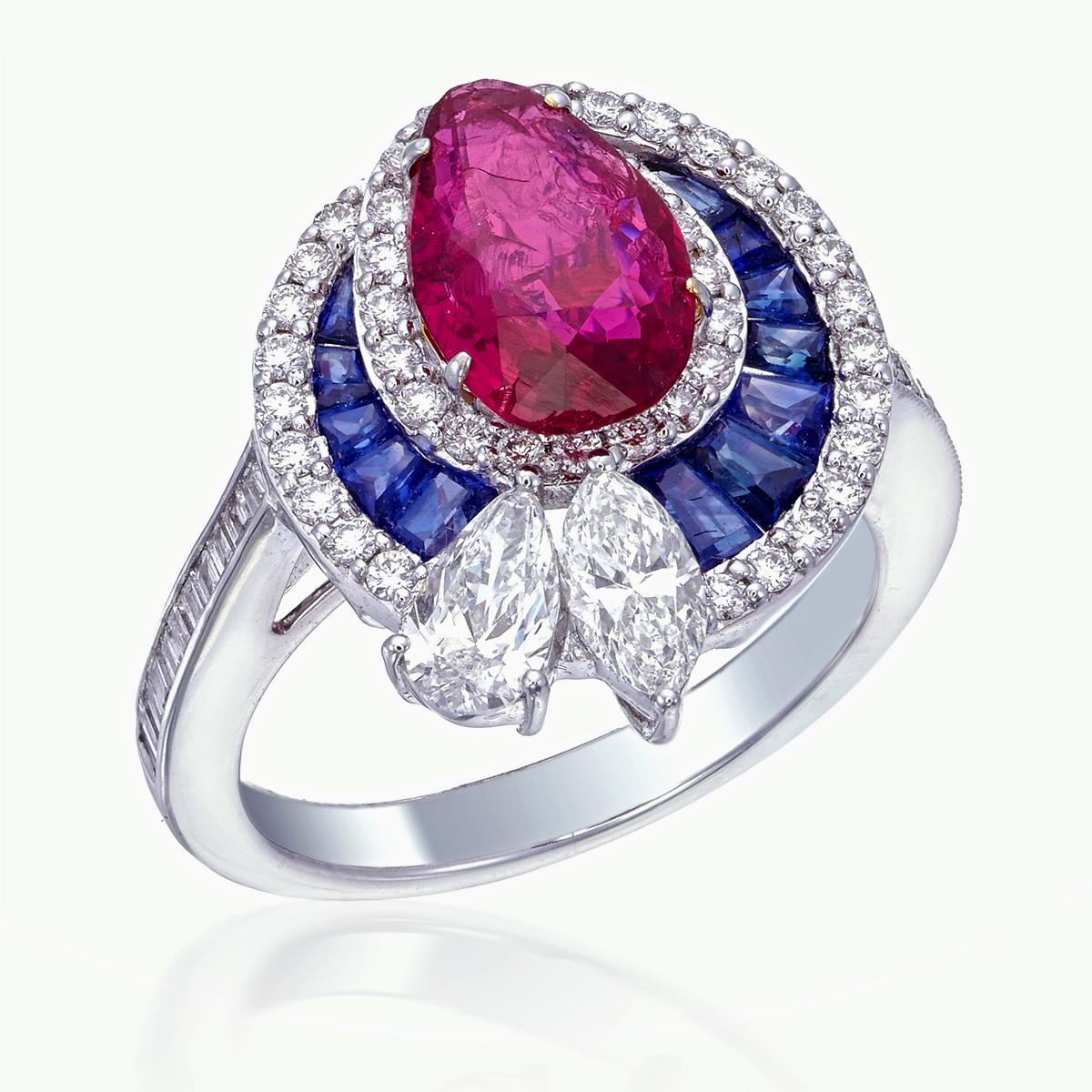 Introducing a brand new ruby and diamond ring by Rewa Jewels. This ring has been inspired by traditional Art Deco themes through it's colorful stones and traditional shaped such as rounds, baguettes, and pears.

The center stone is a 2.19-carat