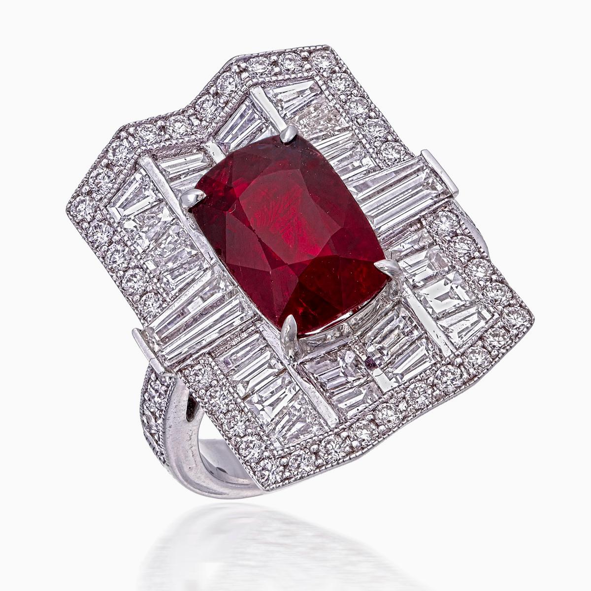 Introducing a brand new ruby and diamond ring by Rewa Jewels. This ring has been inspired by traditional Art Deco themes through it's symmetrical designs and traditional shaped such as rounds, baguettes, and cushions.

The center stone is a