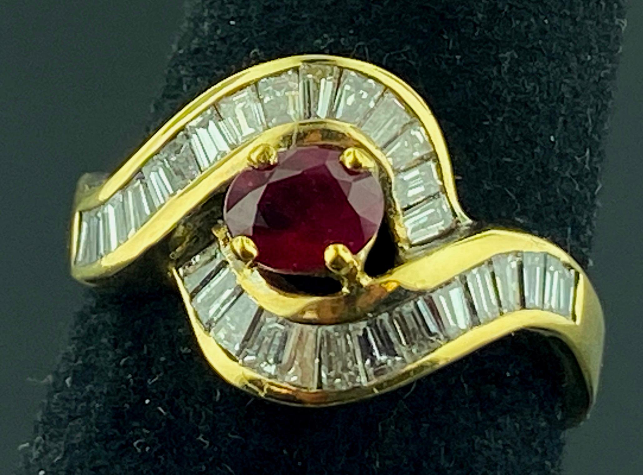Set in 14 karat yellow gold is a center Ruby weighing 0.60 carats, with 29 baguette cut diamonds surrounding and in mounting with a total diamond weight of1.00 carats.  Color is H, Clarity is VS. Ring size is 7.