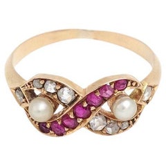 Infinity love ruby and diamond ring in 18k gold, natural pearls